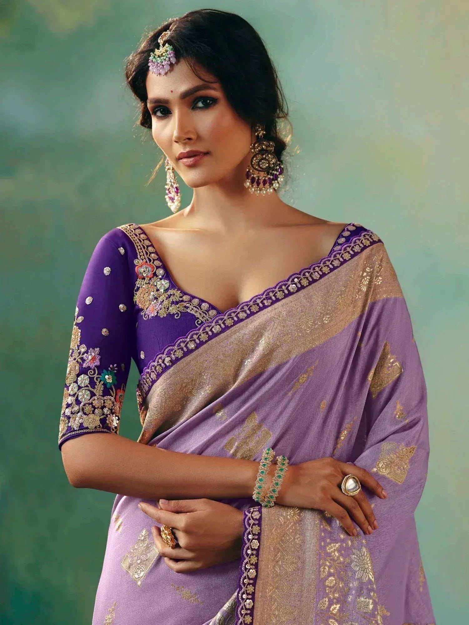 Purple embroidered saree with gold detailing, perfect for Indian ethnic wear occasions