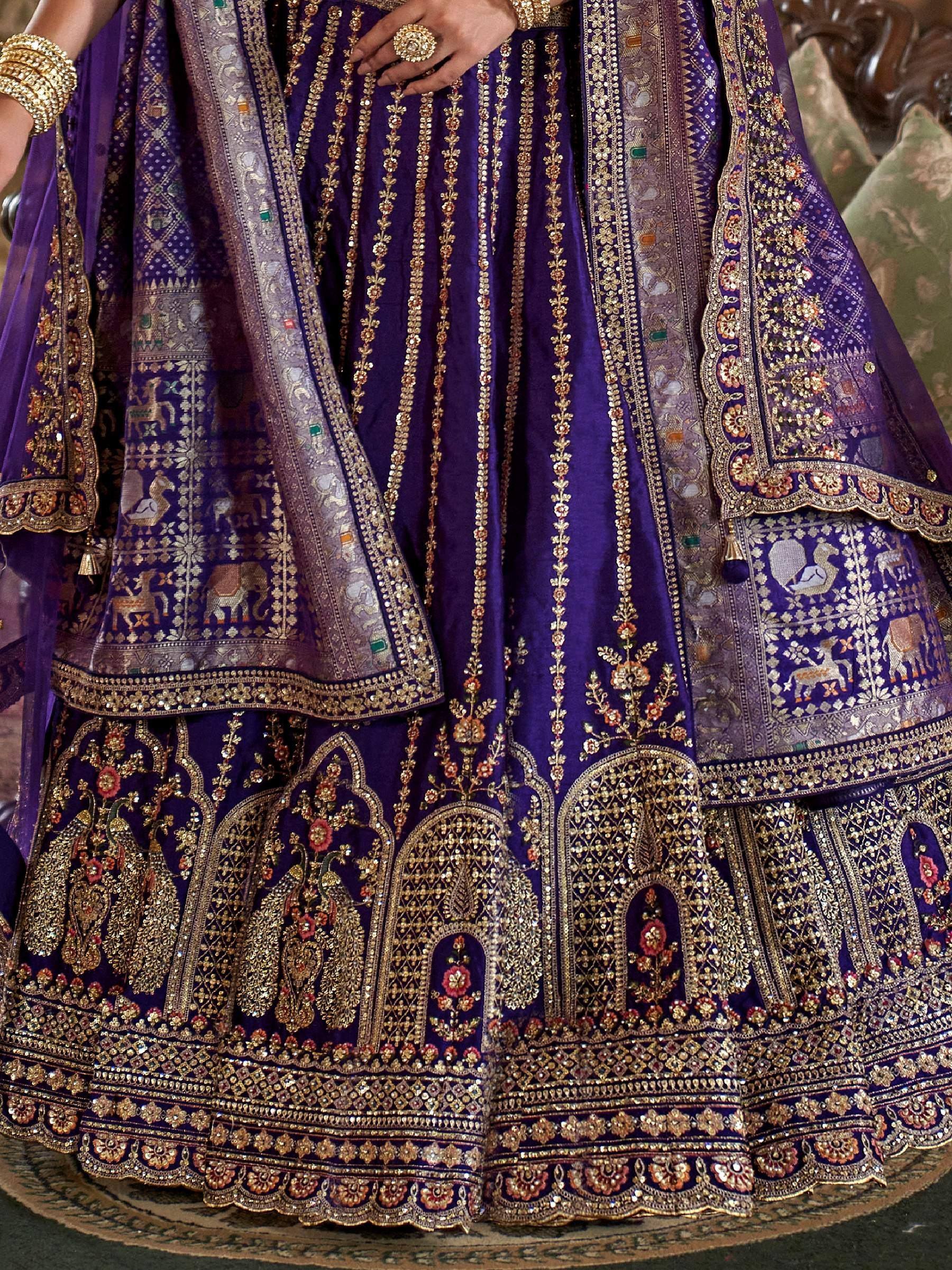 Purple designer lehenga choli with heavy gold embroidery and animal motifs, perfect for Indian weddings