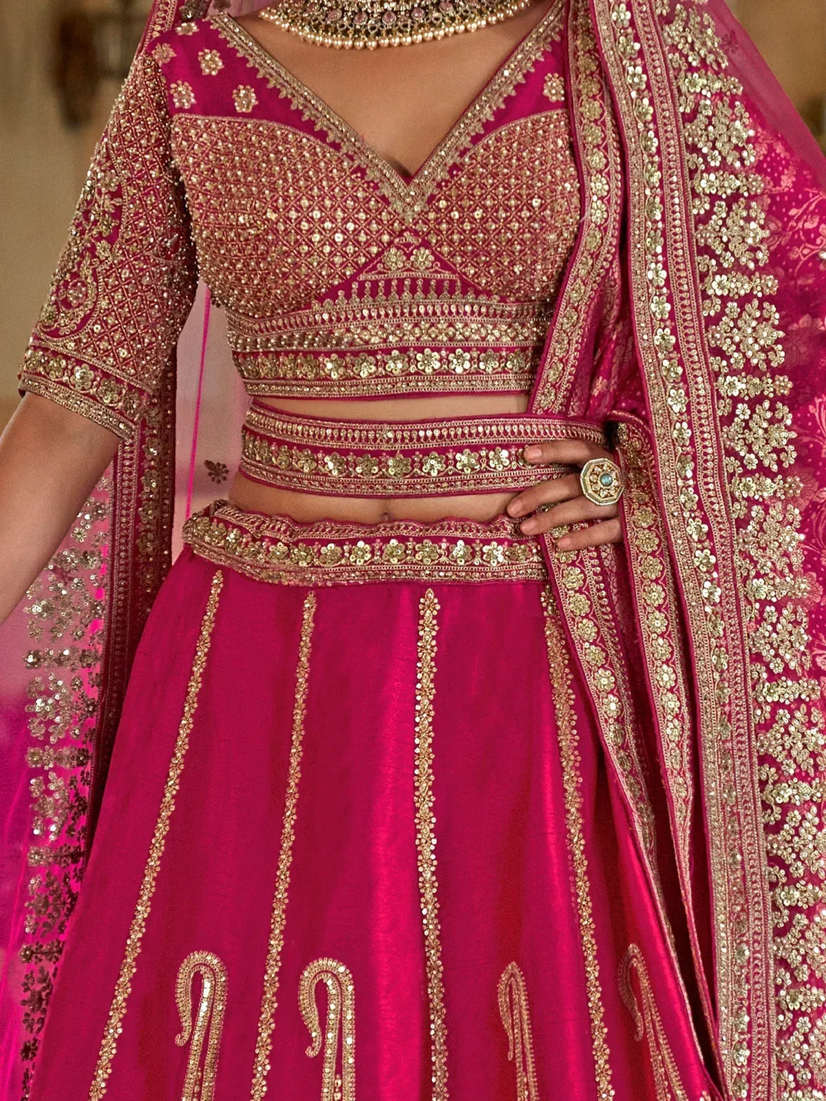 Fuchsia designer lehenga choli with gold embroidery and embellished dupatta for Indian ethnic wear