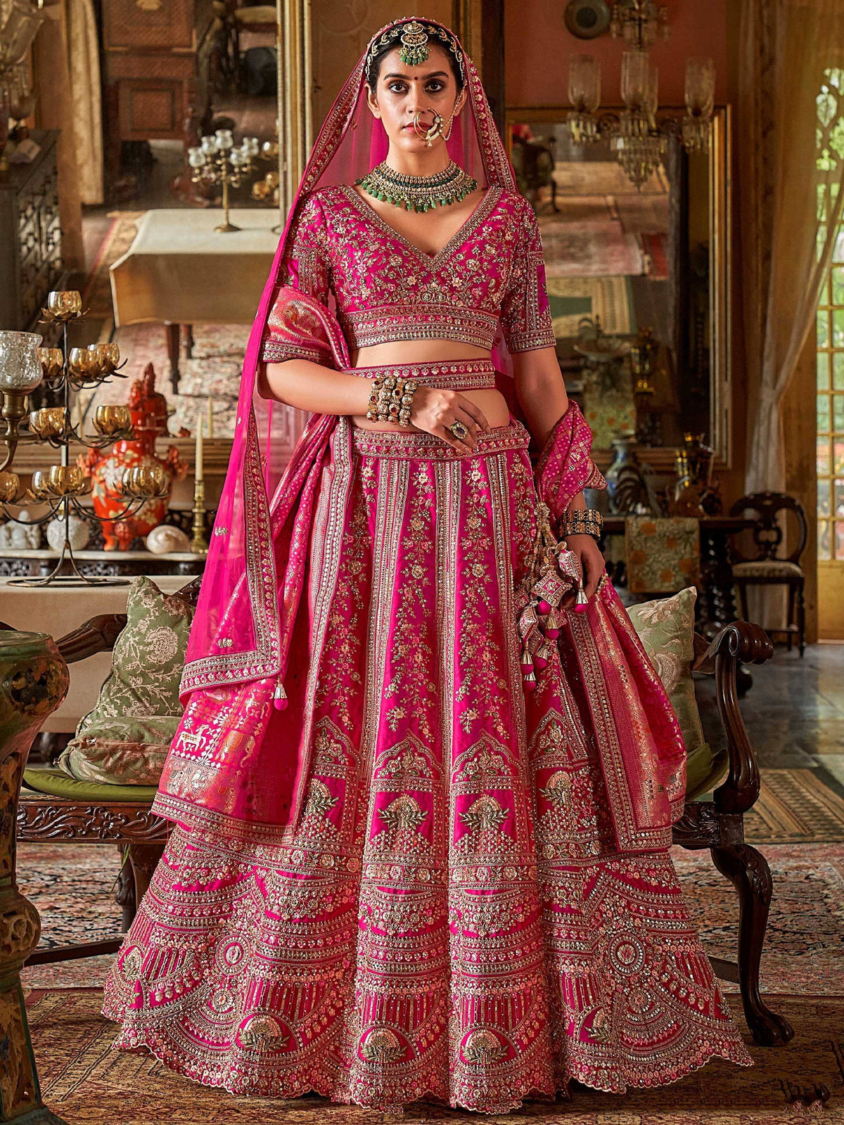 Pink embroidered lehenga choli with gold detailing, perfect for Indian weddings and ethnic occasions.