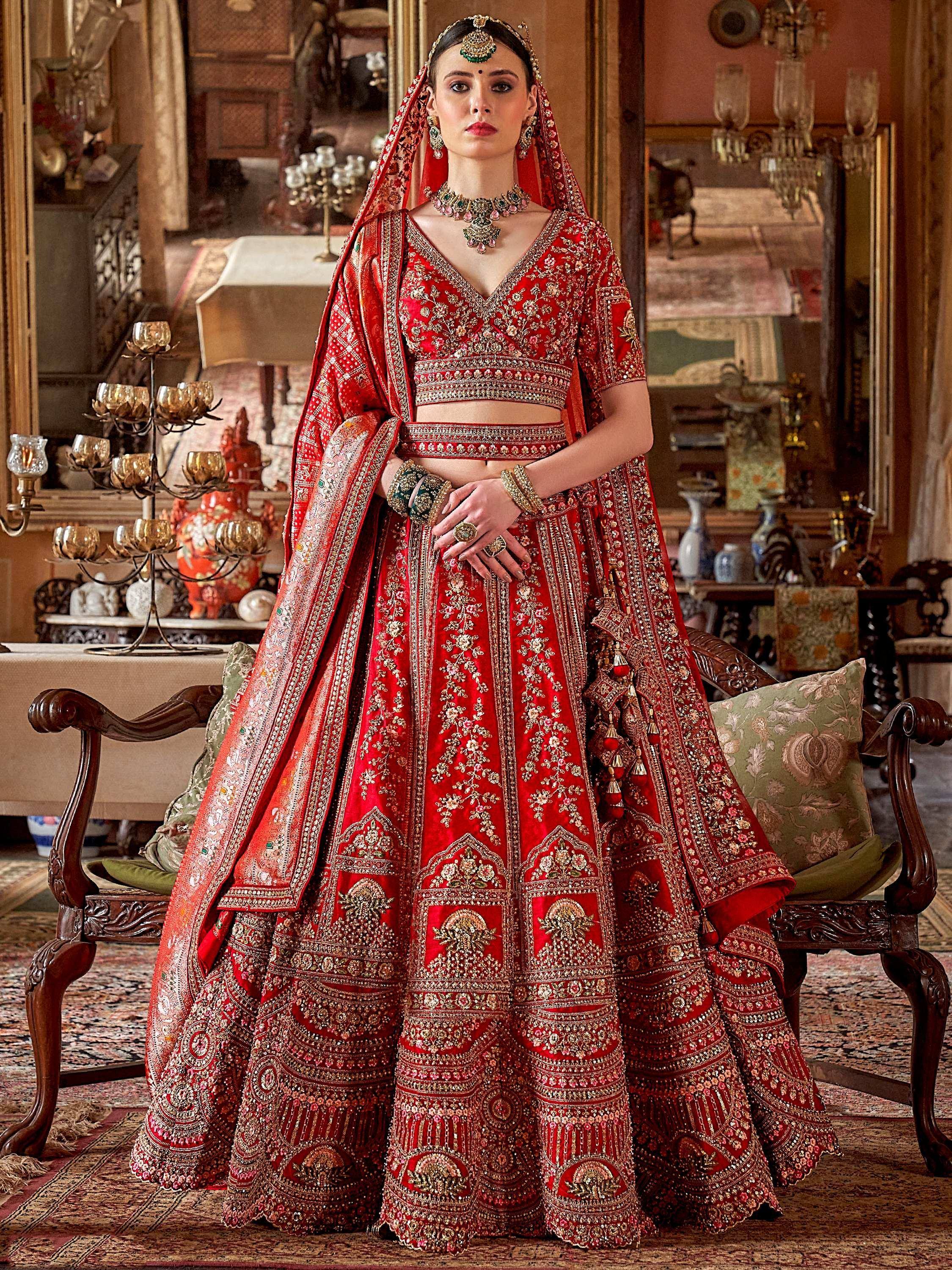 Red embroidered bridal lehenga choli with dupatta, traditional Indian wedding attire