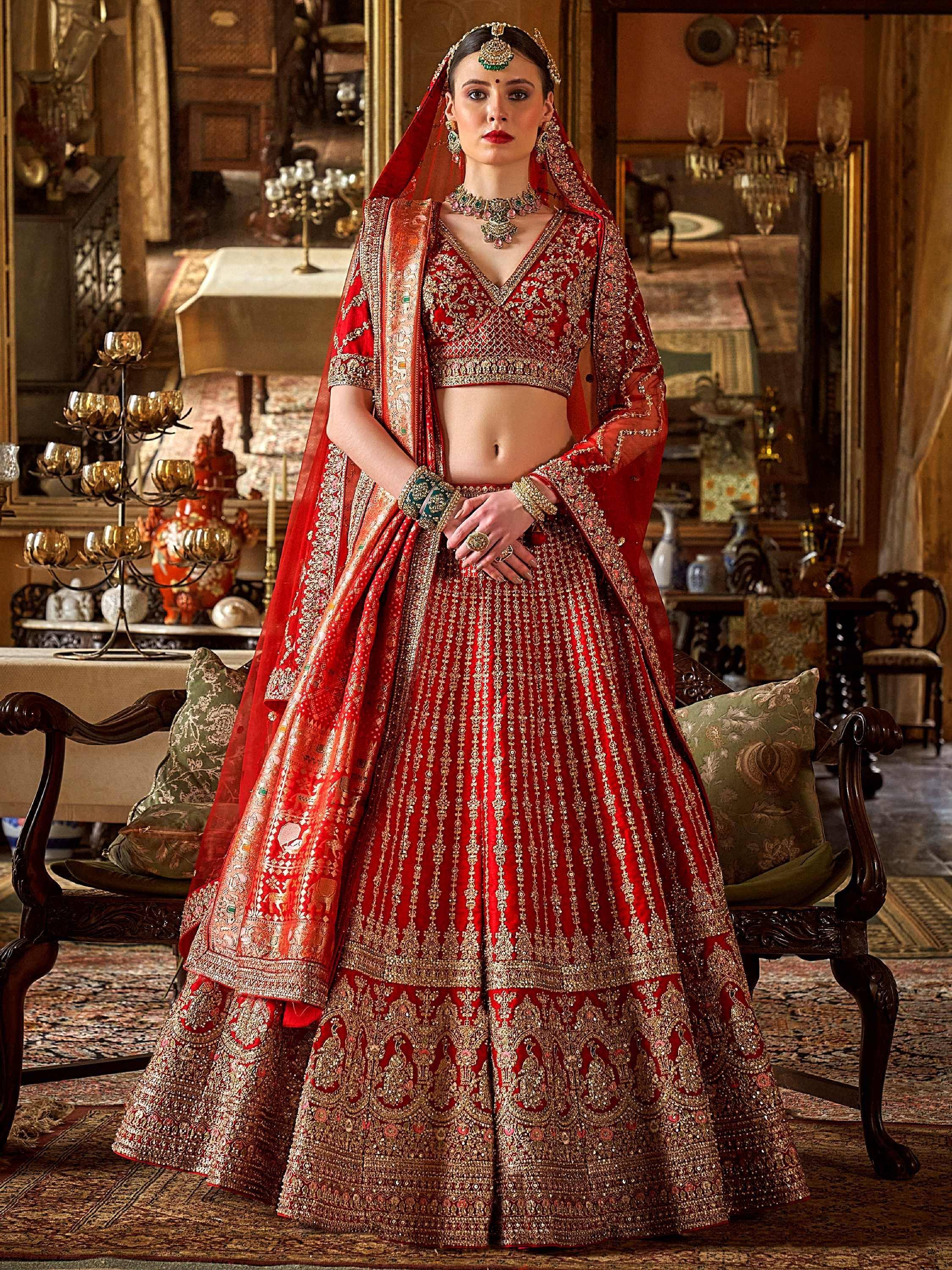 Red bridal lehenga choli with heavy gold embroidery and dupatta, Indian ethnic wear for weddings