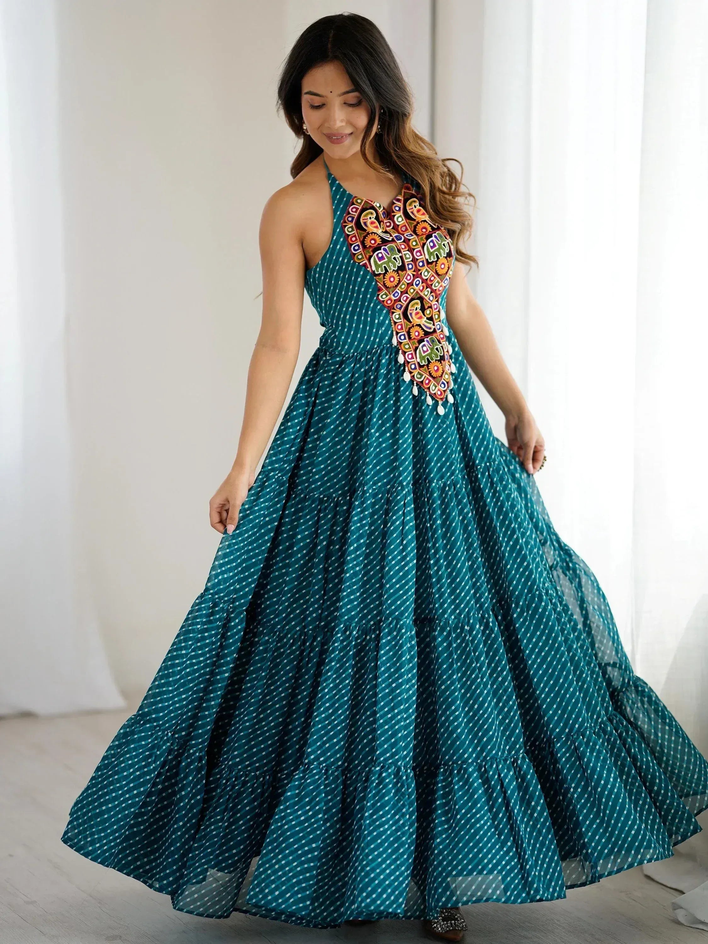 Teal ethnic gown with colorful embroidery and tiered skirt for women