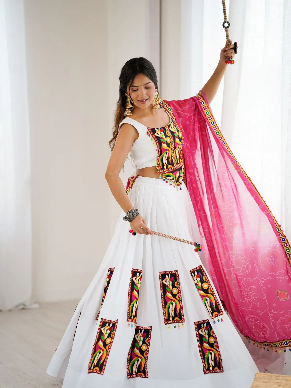 White embroidered lehenga with pink dupatta, perfect for Indian ethnic wear and festive occasions.