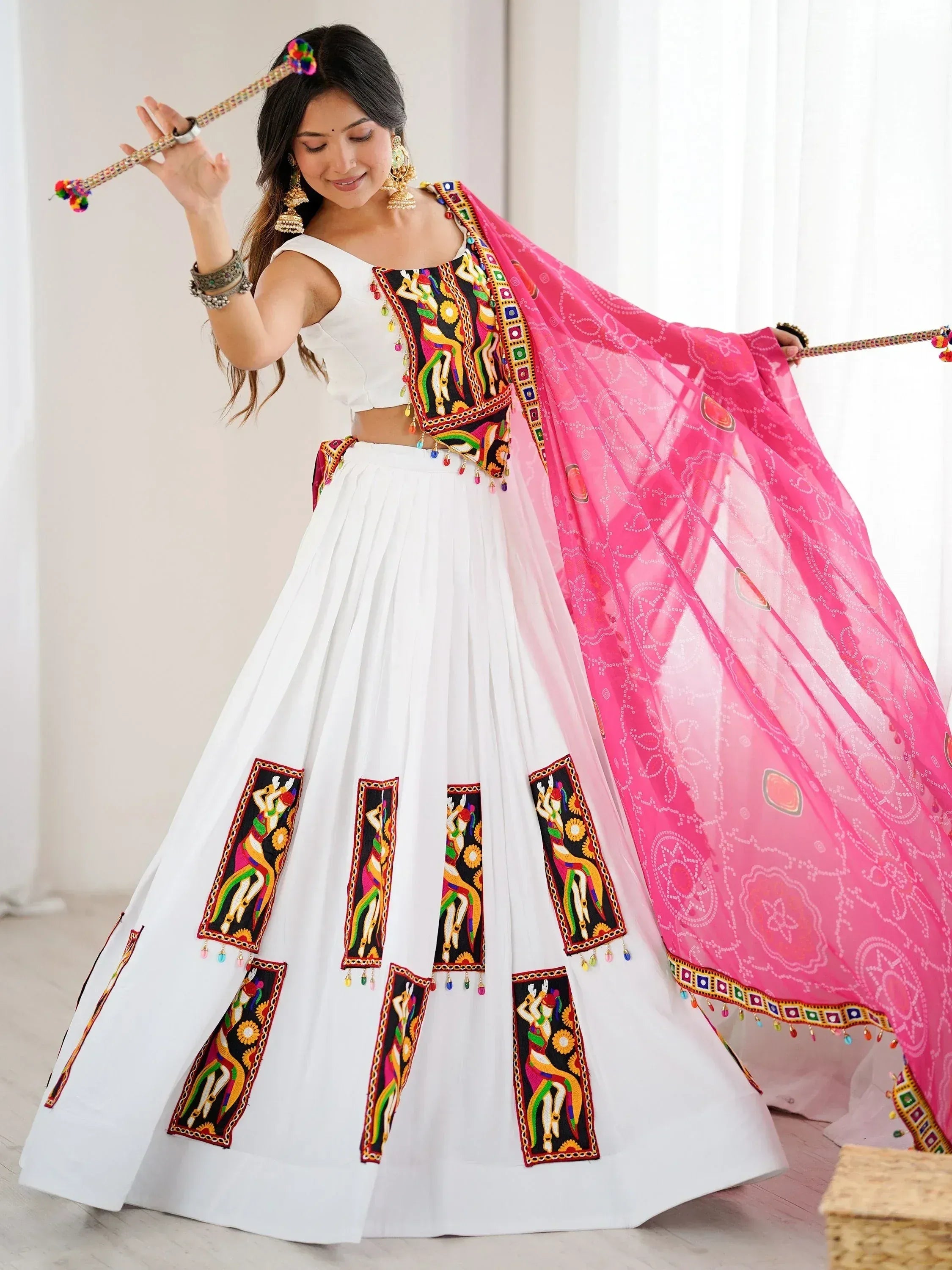 White embroidered lehenga choli with pink dupatta, traditional Indian ethnic wear for women