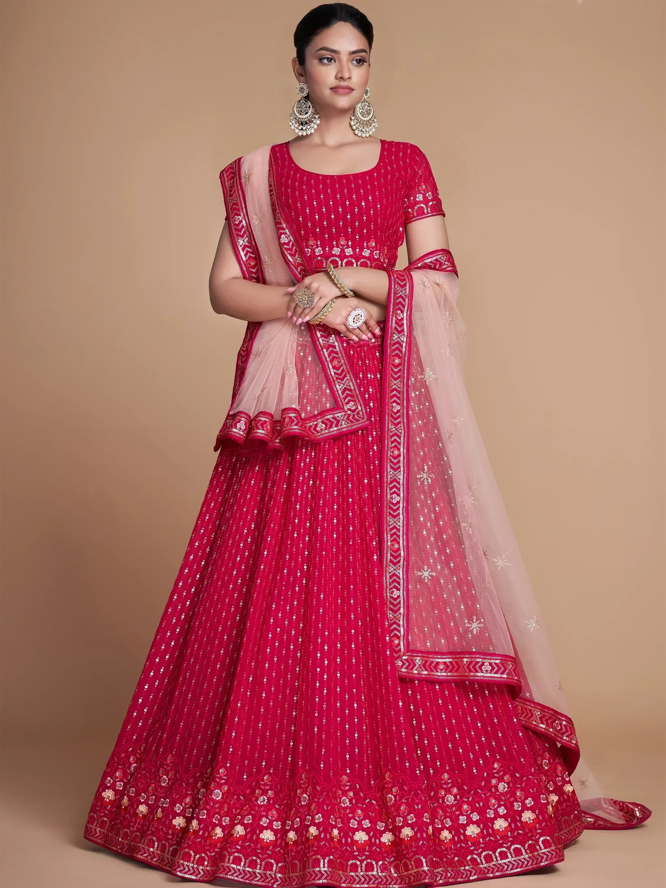 Red embroidered lehenga choli with sheer dupatta, perfect for Indian ethnic wear occasions