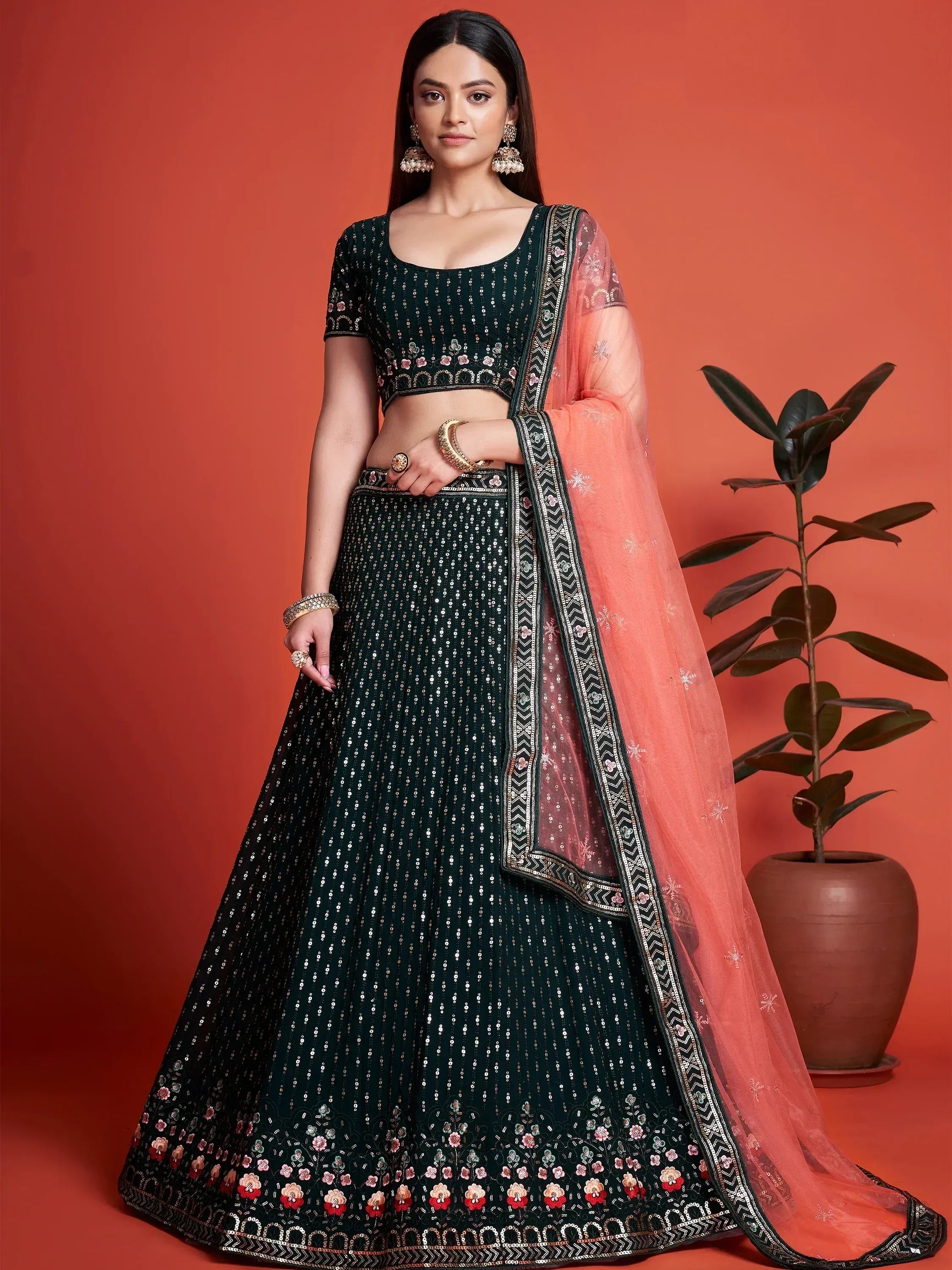 Emerald green lehenga choli with floral embroidery and peach dupatta for Indian ethnic wear
