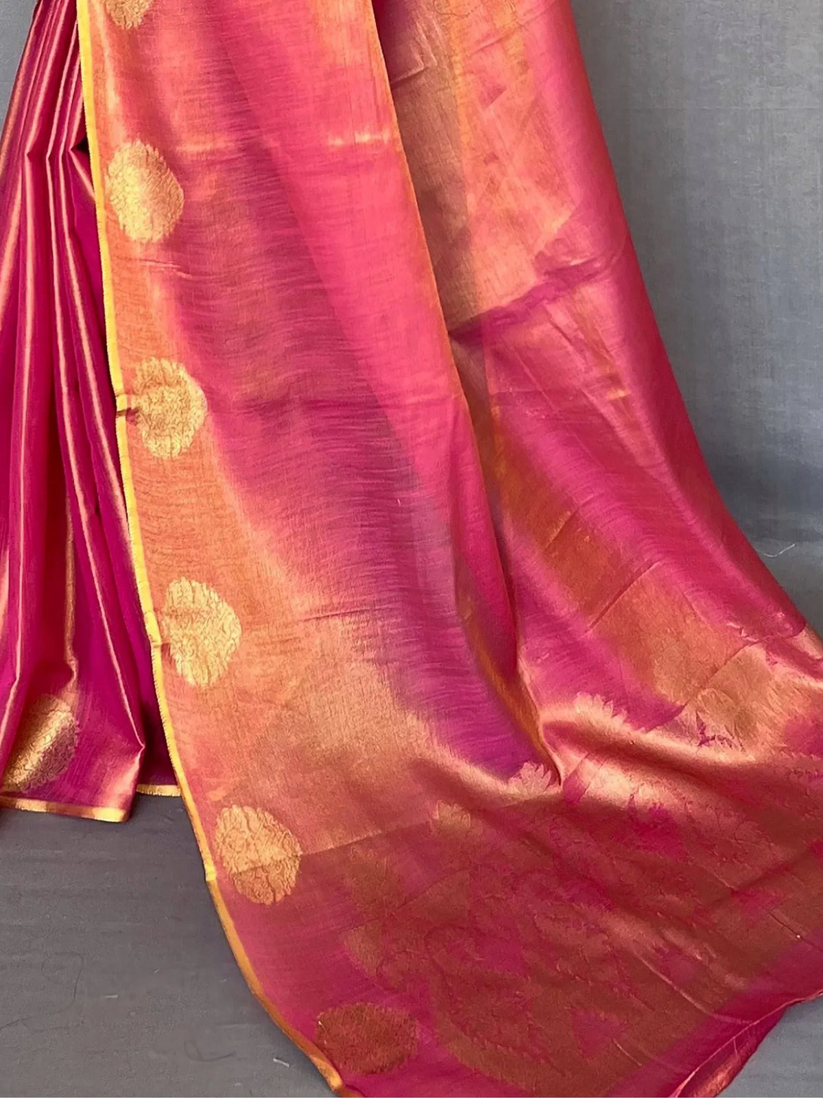 Pink and orange silk saree with gold floral motifs and border, ideal for Indian ethnic wear