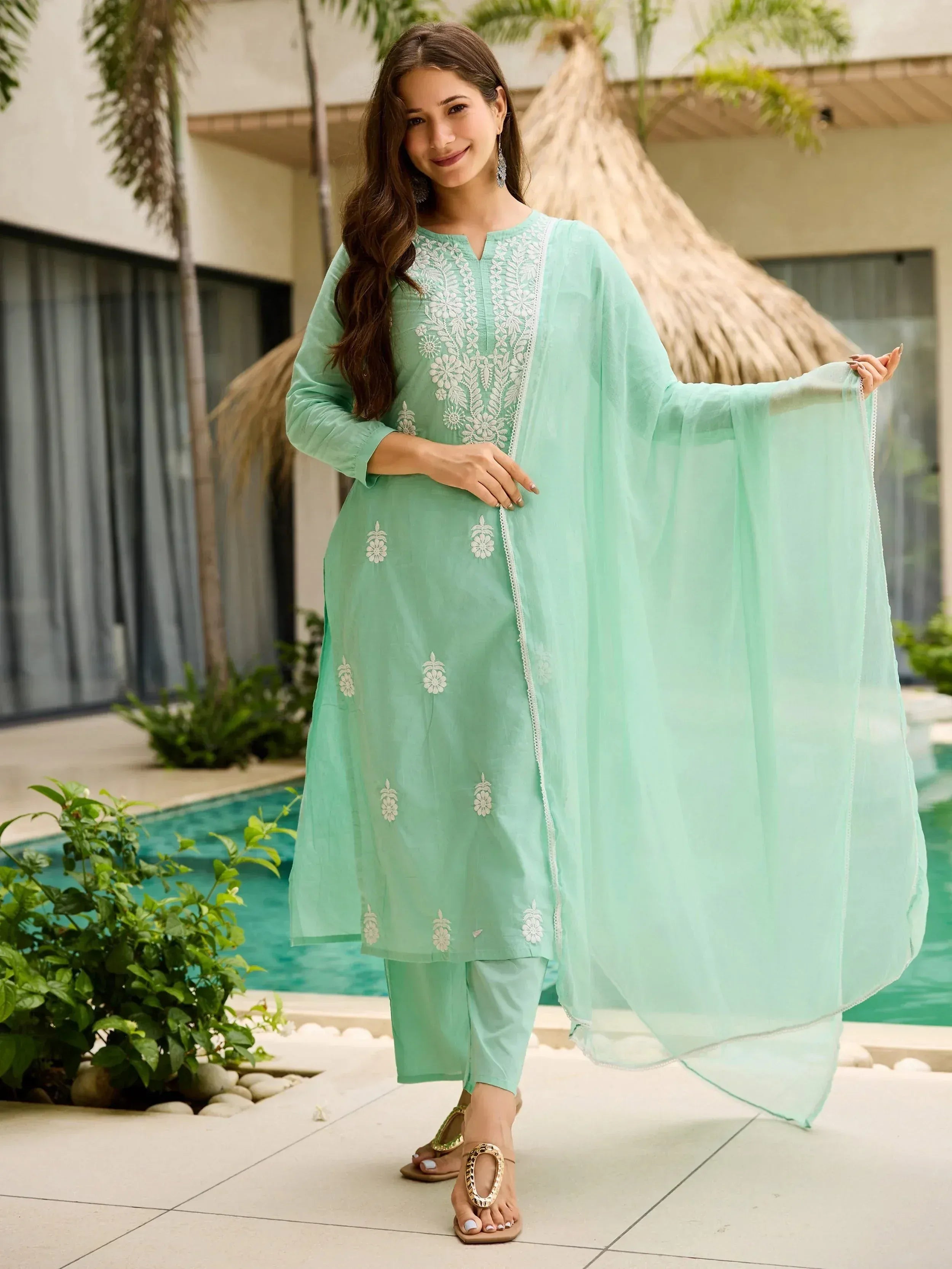 Mint green embroidered salwar kameez with sheer dupatta, perfect for ethnic wear and festive occasions.