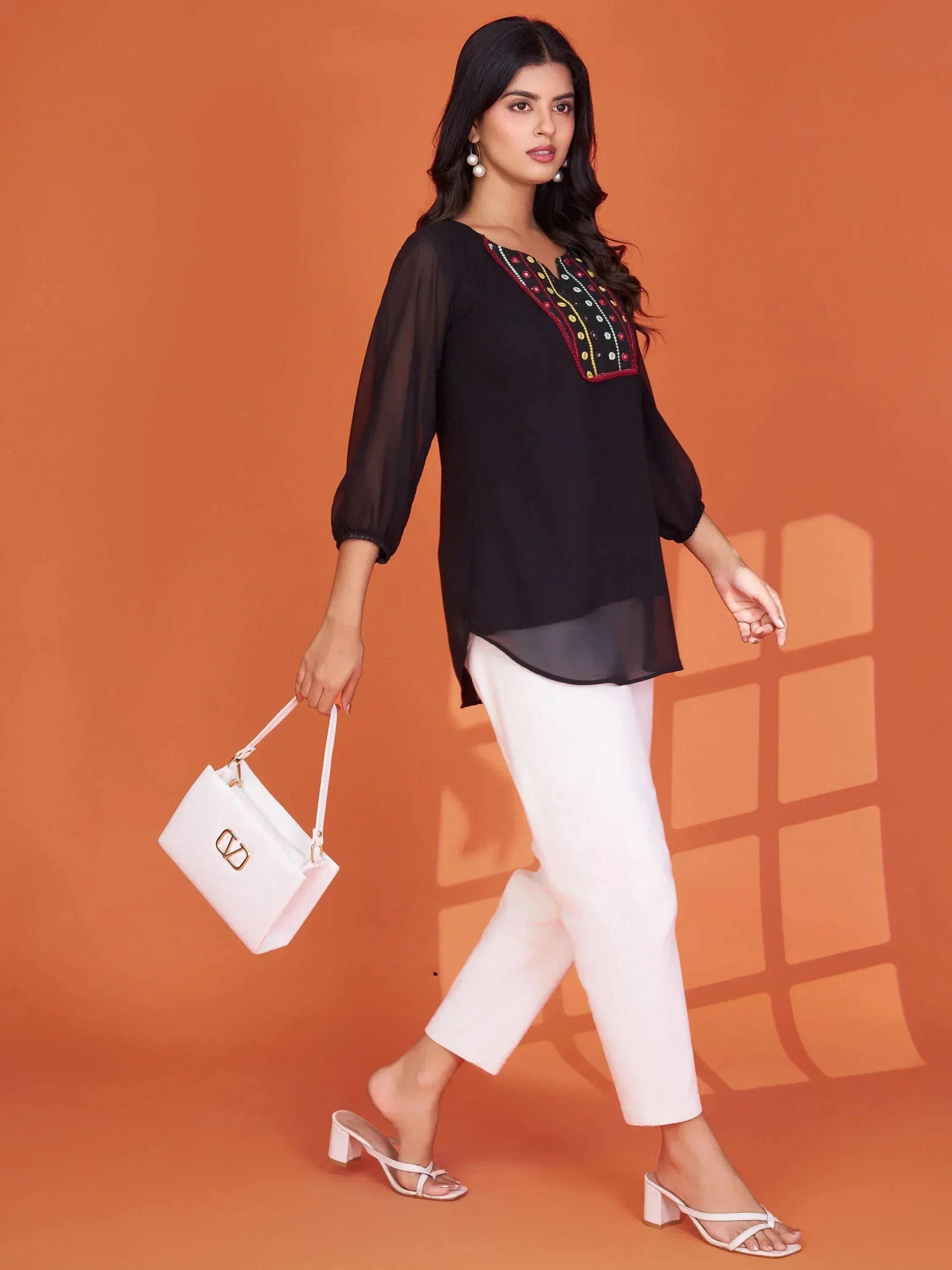 Black embroidered kurta with white pants, stylish ethnic wear for women