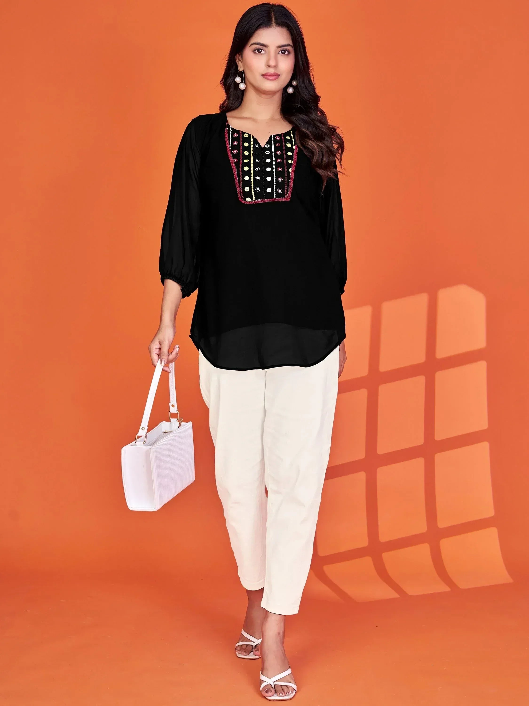 Black embroidered kurta with white palazzo pants, perfect for Indian ethnic wear