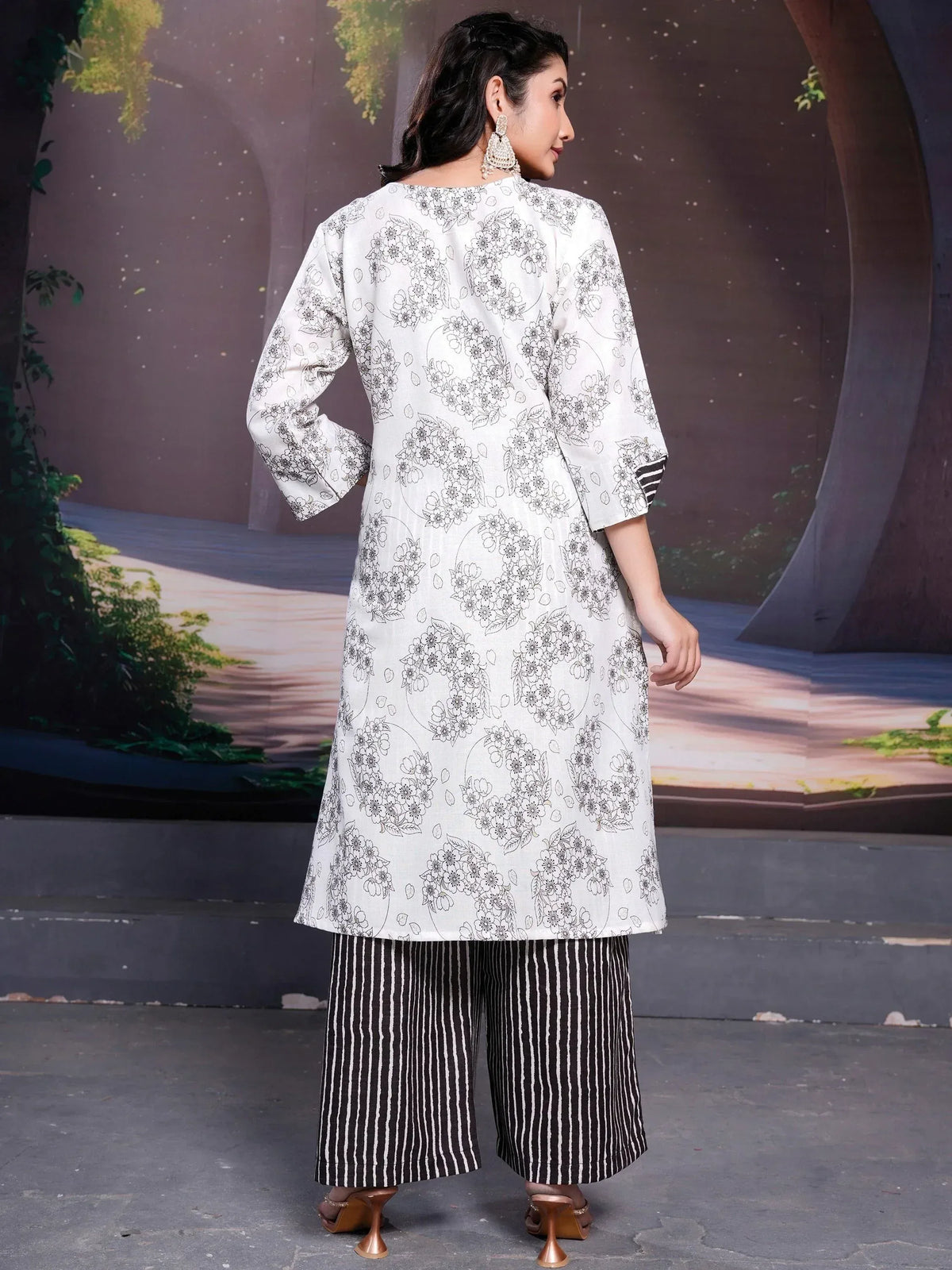 White floral print kurta with black striped palazzo pants, ethnic wear outfit