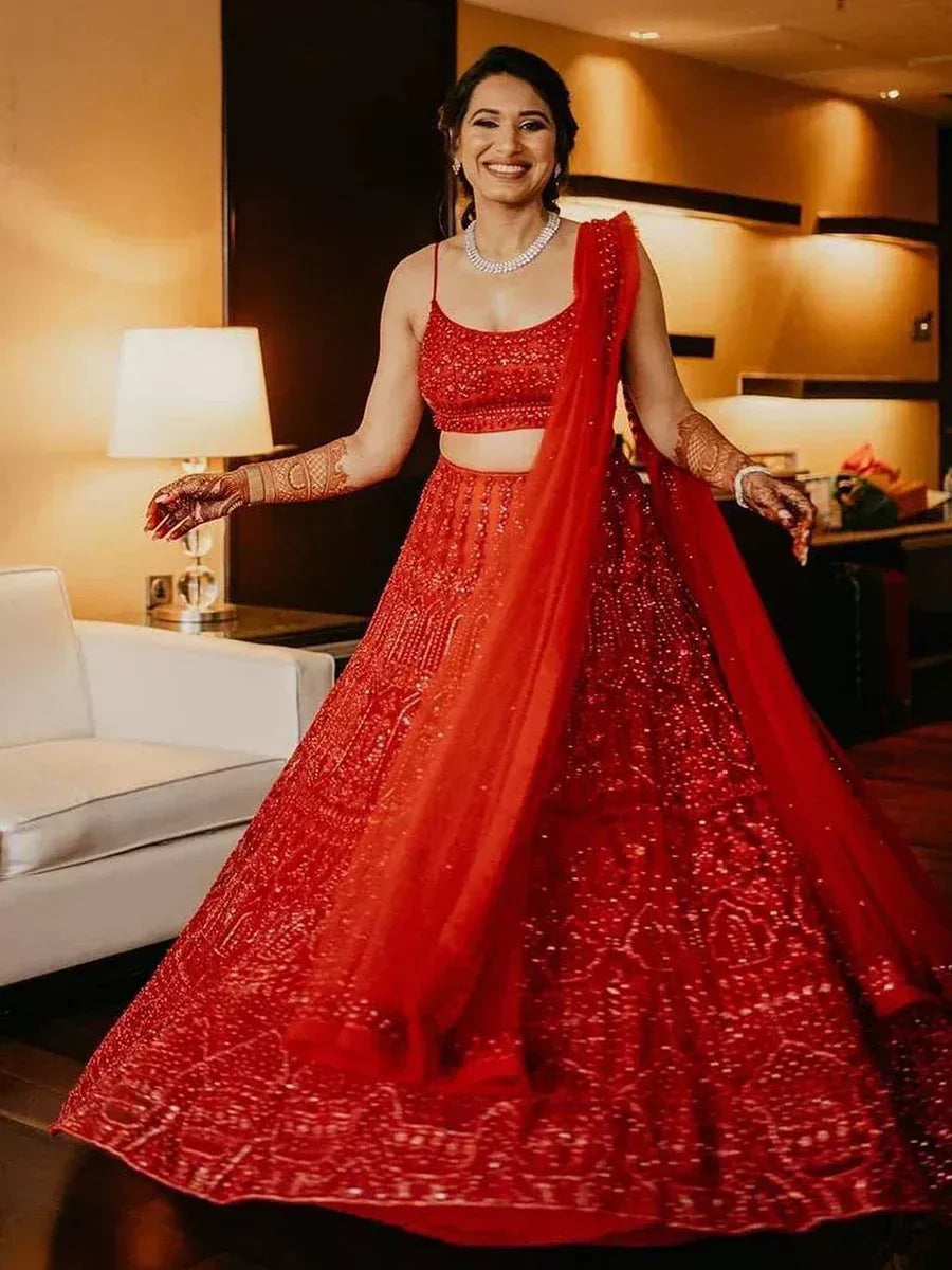 Red embroidered lehenga choli with dupatta, perfect for Indian weddings and festive occasions