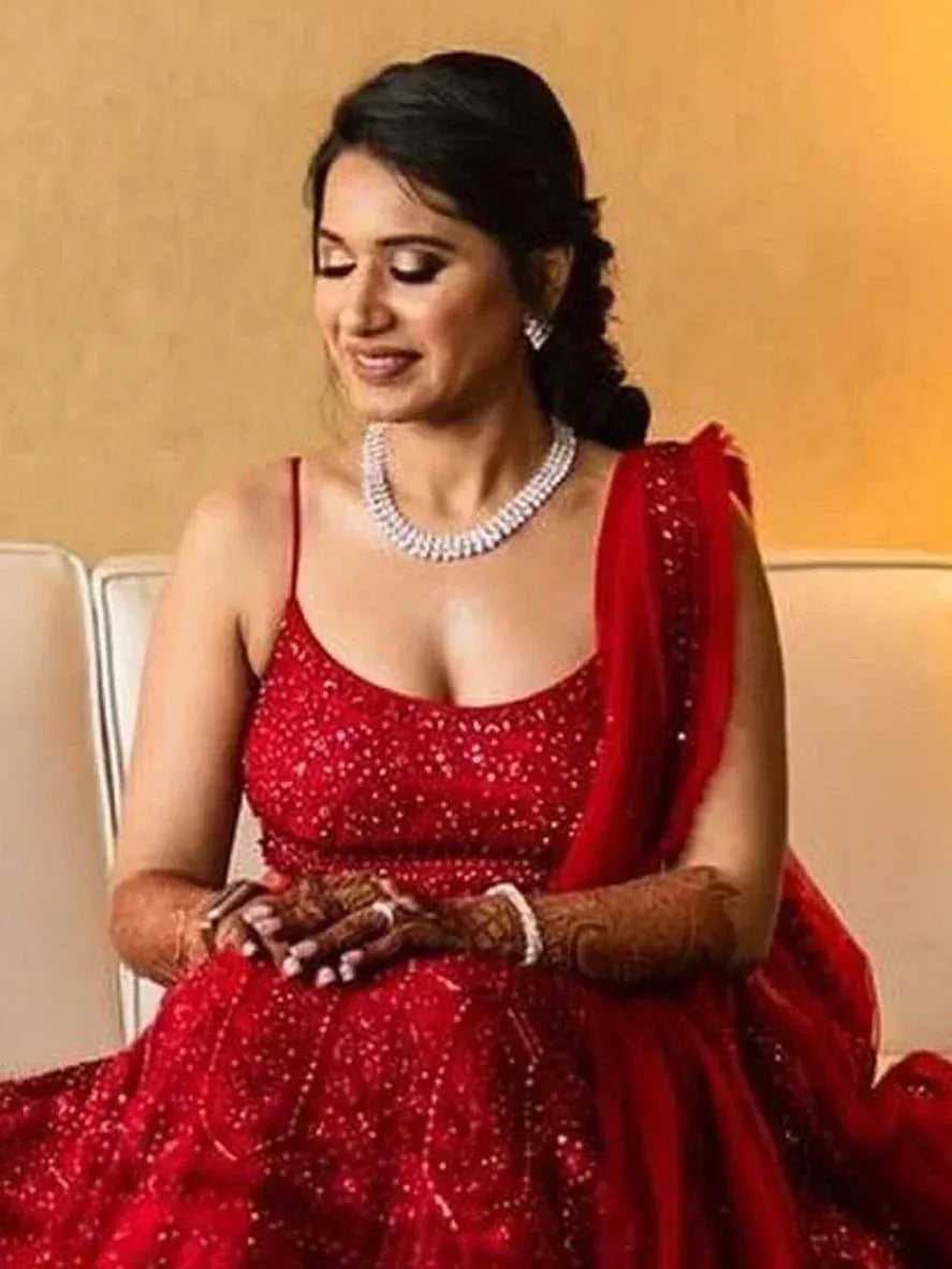 Red sequined lehenga choli with dupatta, perfect for Indian weddings and festive occasions