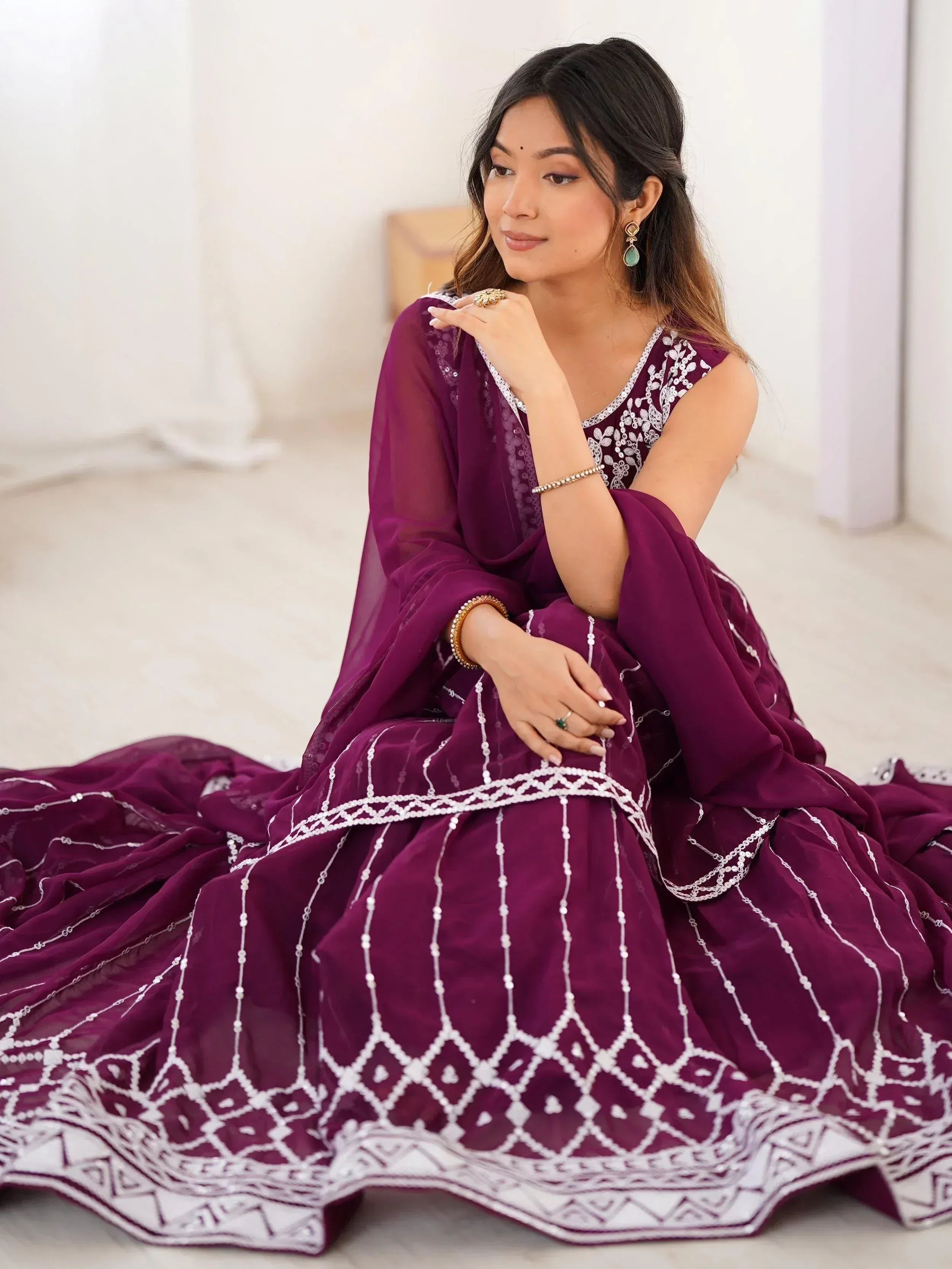 Elegant purple designer lehenga choli with white embroidery, perfect for Indian ethnic wear occasions.