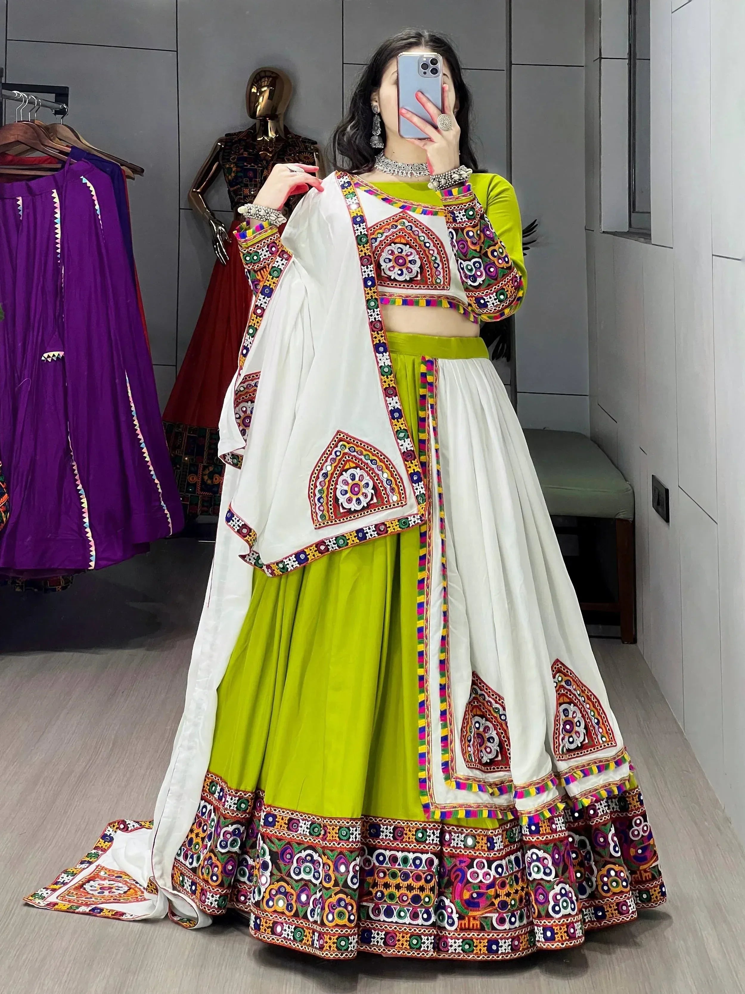 Vibrant green and white embroidered lehenga choli with mirror work, perfect for Indian ethnic wear