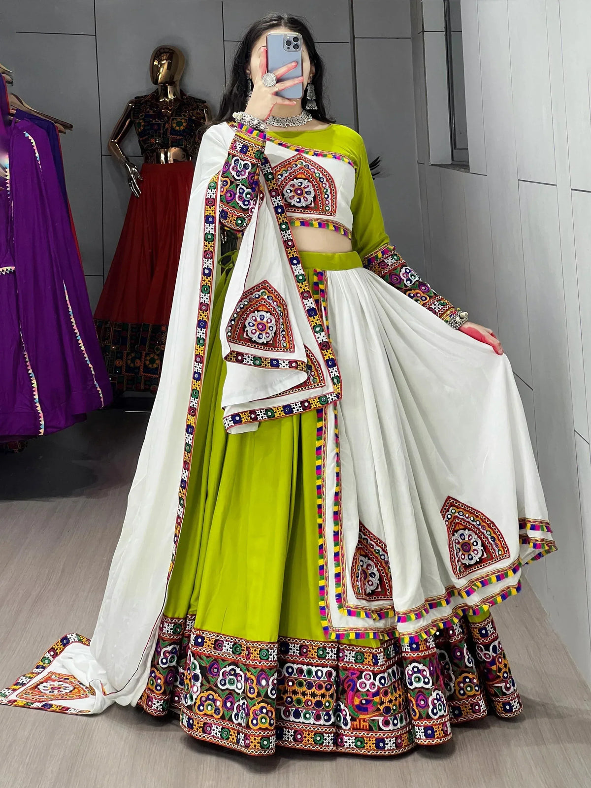 Vibrant green and white embroidered lehenga choli with mirror work, perfect for Indian ethnic wear