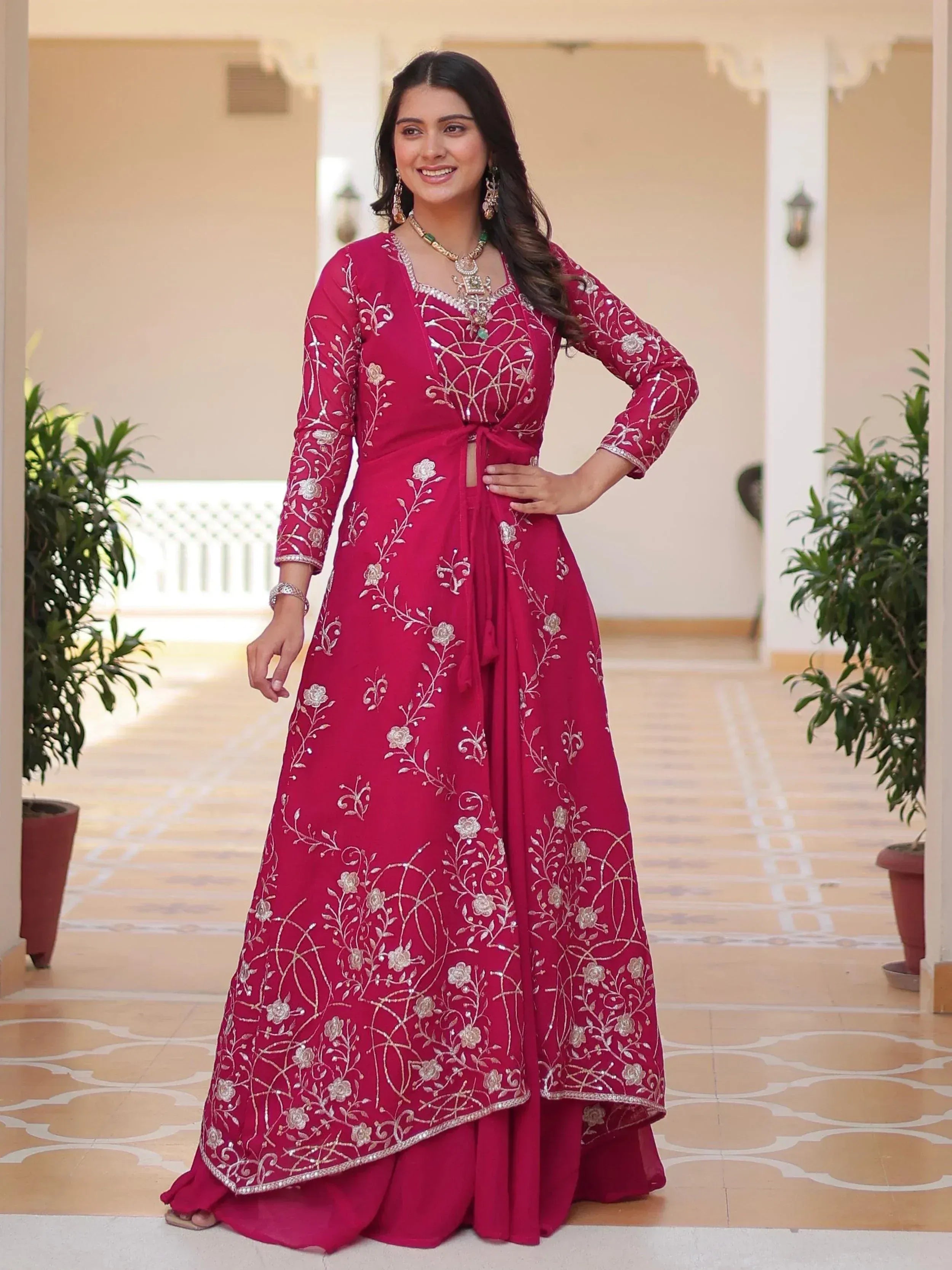 Elegant maroon ethnic gown with floral embroidery, perfect for Indian celebrations