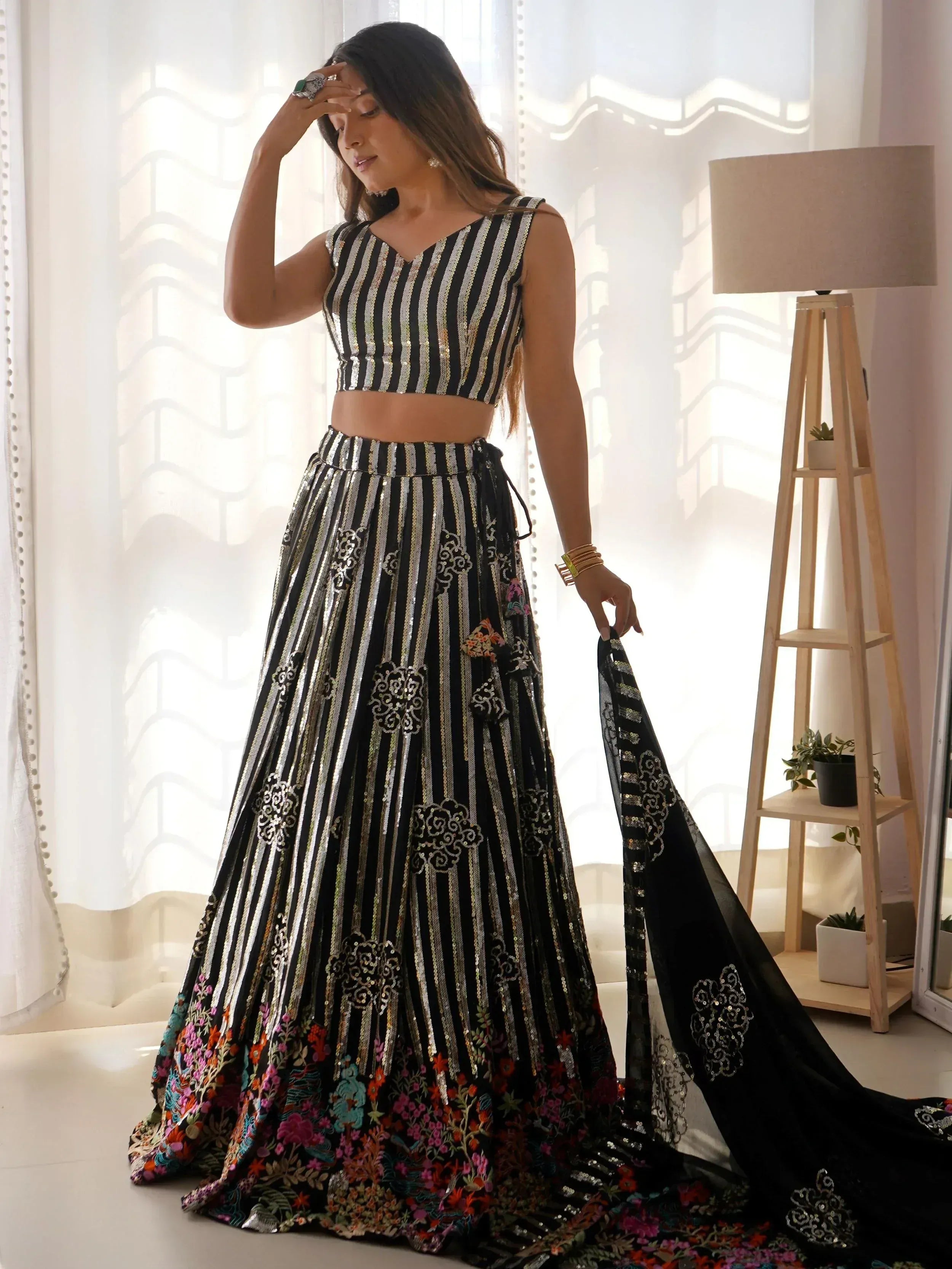 Black and silver striped lehenga choli with floral embroidery, perfect for Indian ethnic wear events.