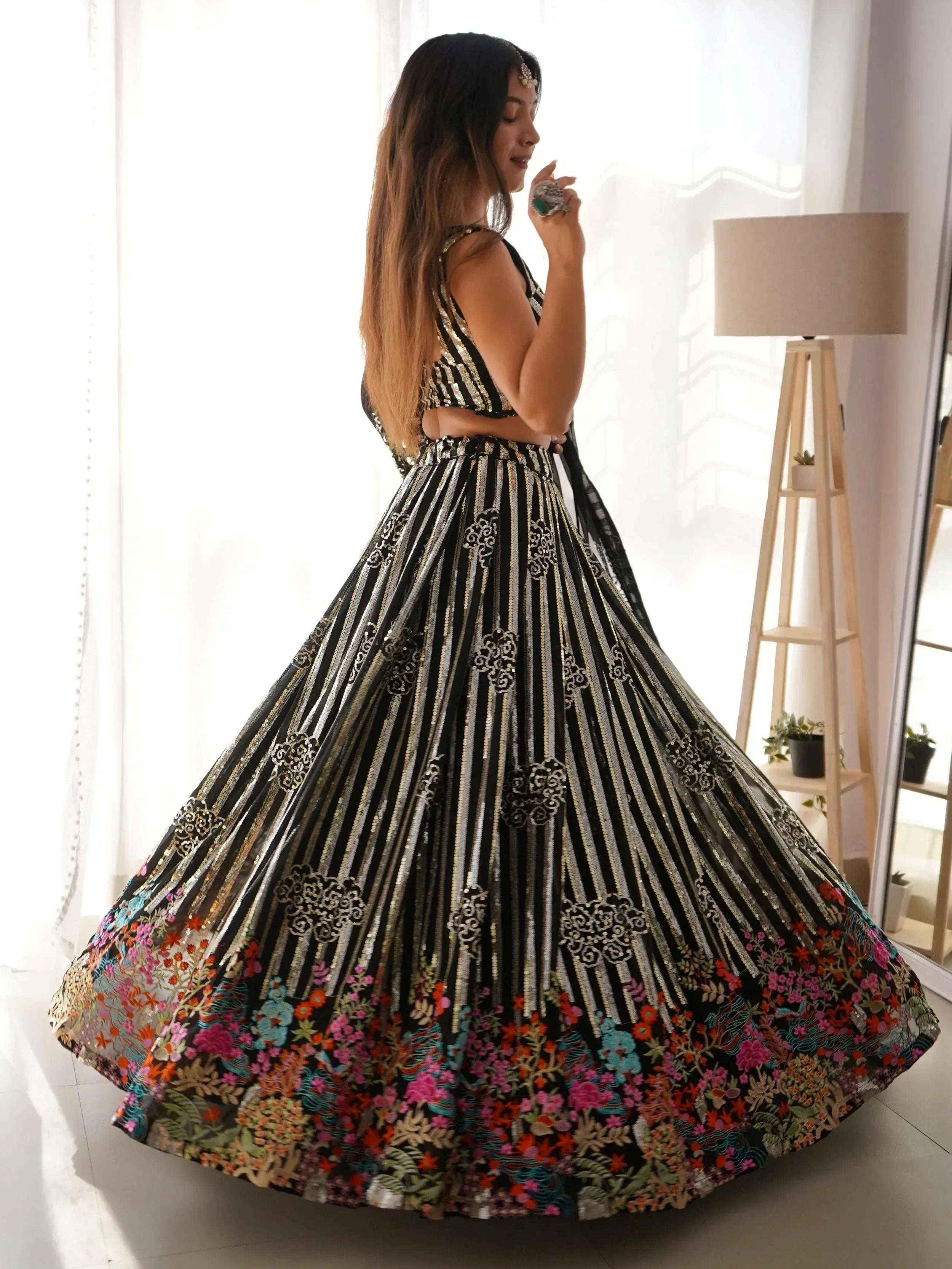 Black and gold striped lehenga choli with floral embroidery, perfect for Indian ethnic wear occasions