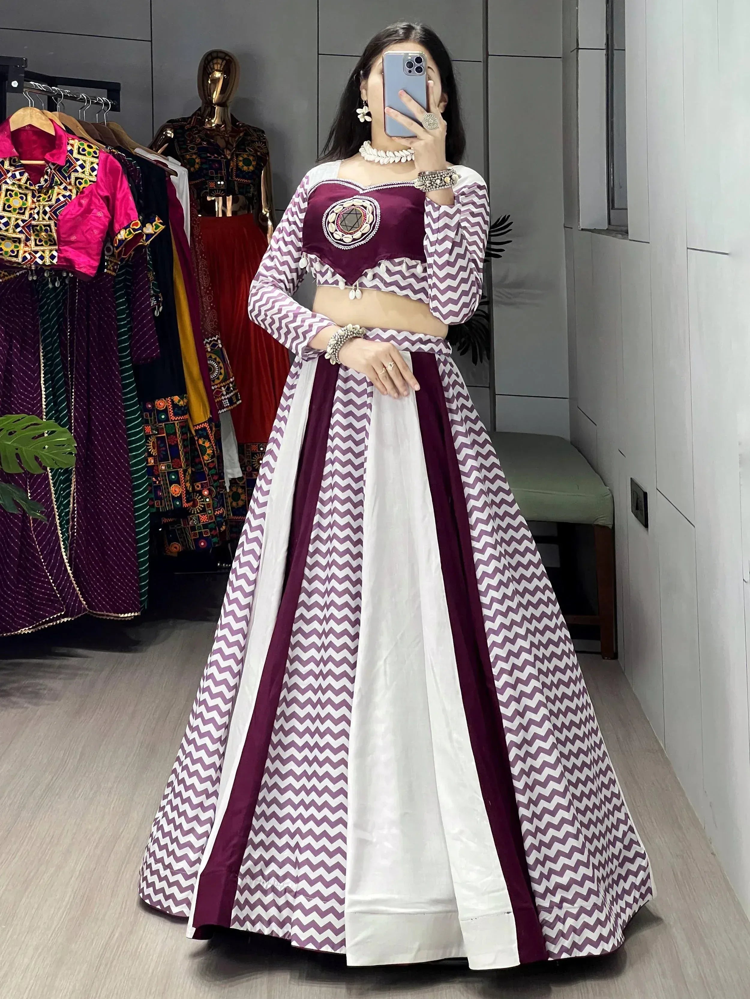 Woman in purple and white chevron print lehenga choli with embroidered blouse, ethnic wear