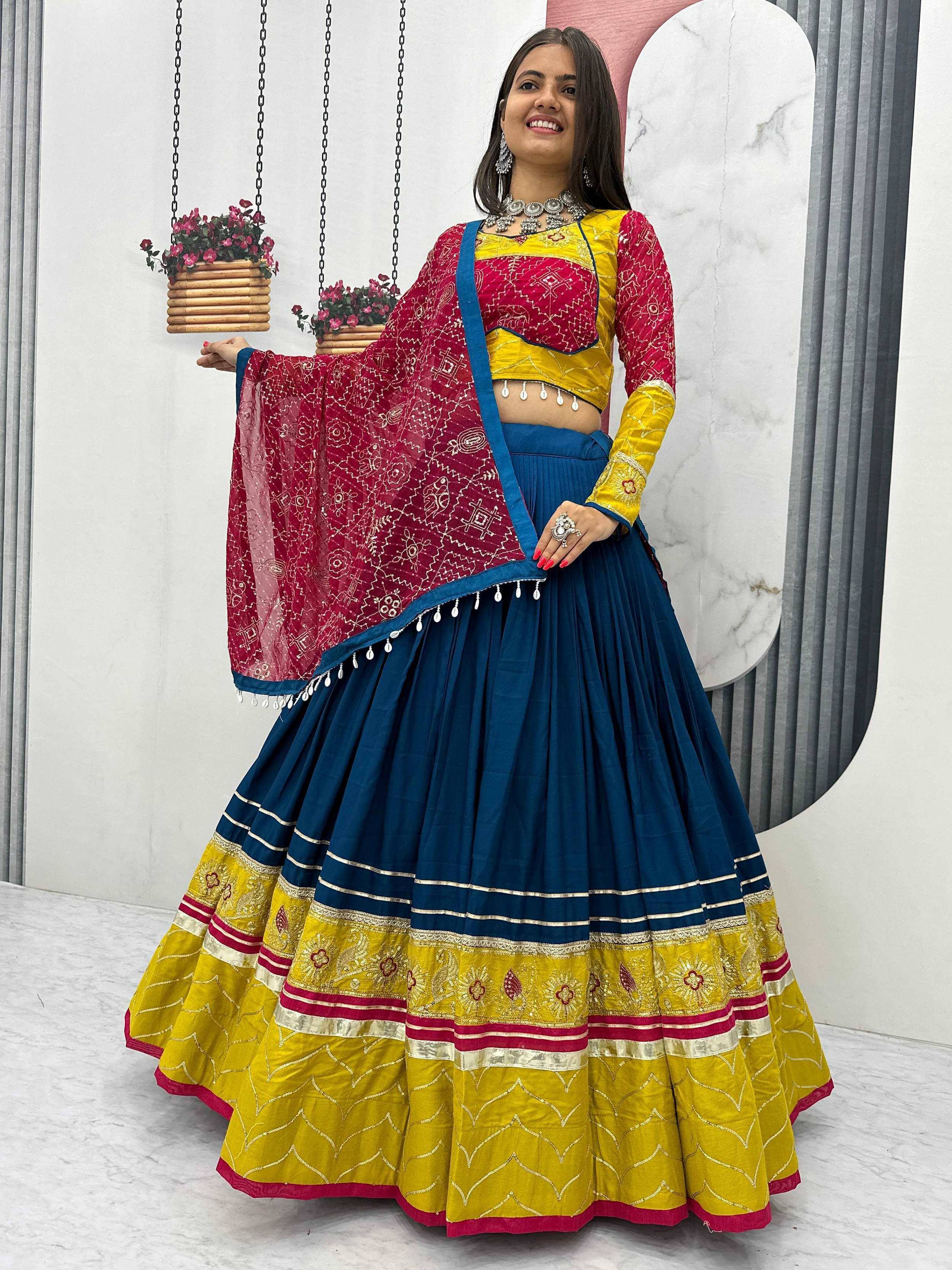 Vibrant blue and yellow lehenga choli with red dupatta, perfect for Indian ethnic wear occasions.