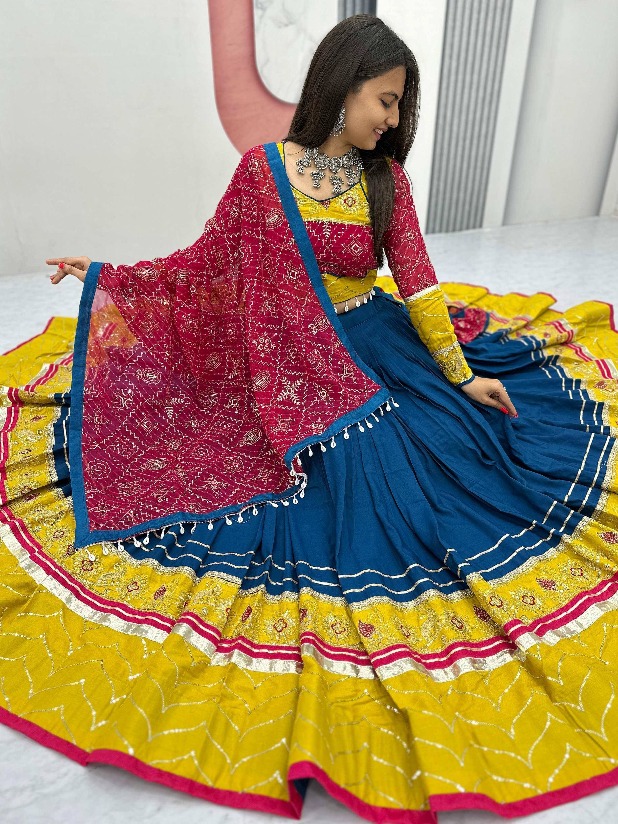 Vibrant blue and yellow lehenga choli with red dupatta, perfect for Indian ethnic wear and festive occasions.