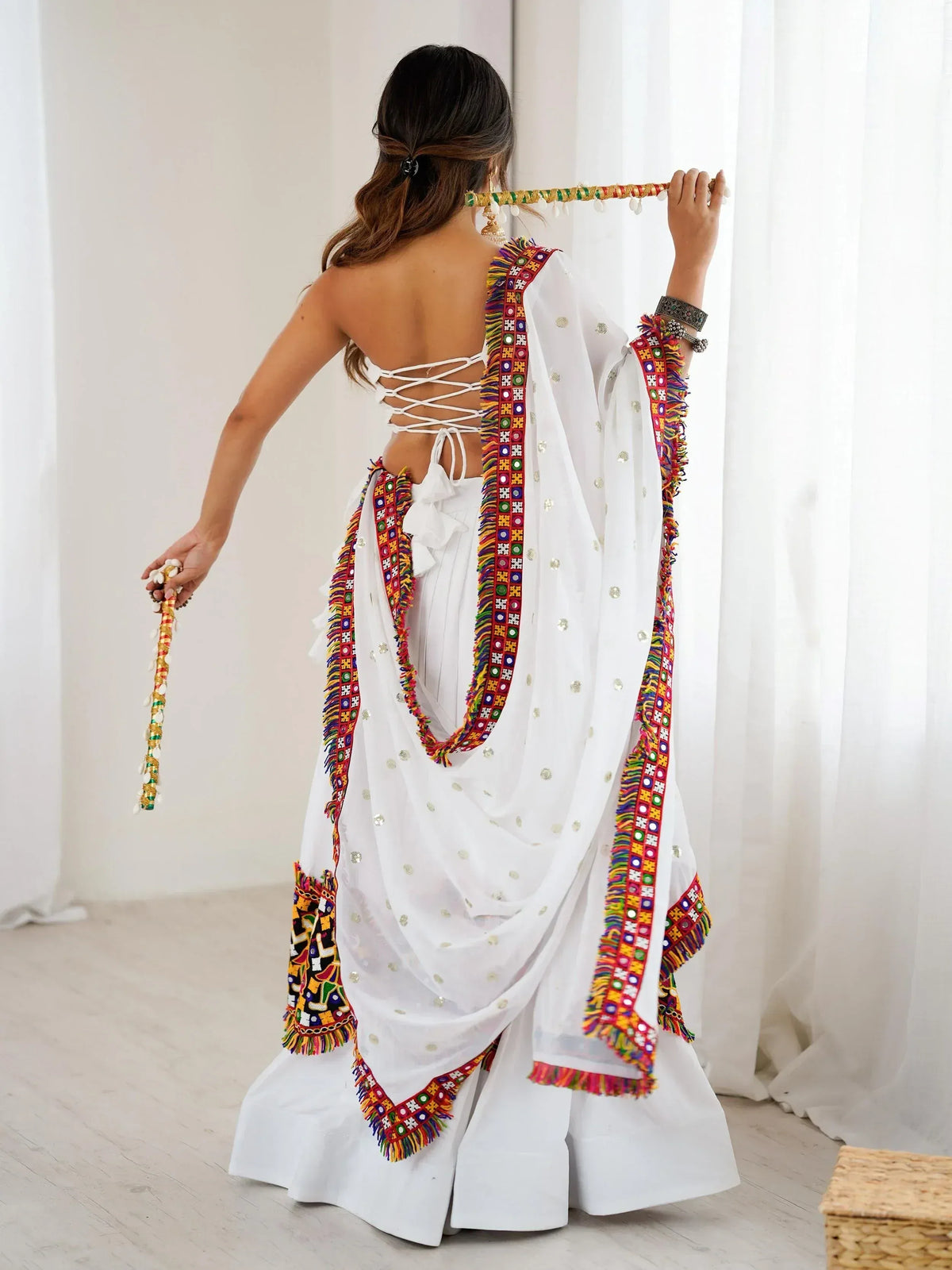 White ethnic gown with colorful embroidery and back lace-up design