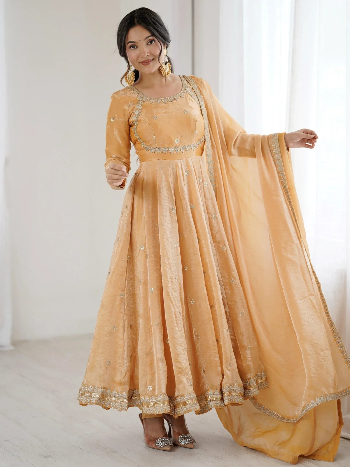 Elegant mustard yellow anarkali suit with gold embroidery and dupatta, perfect for Indian ethnic occasions.