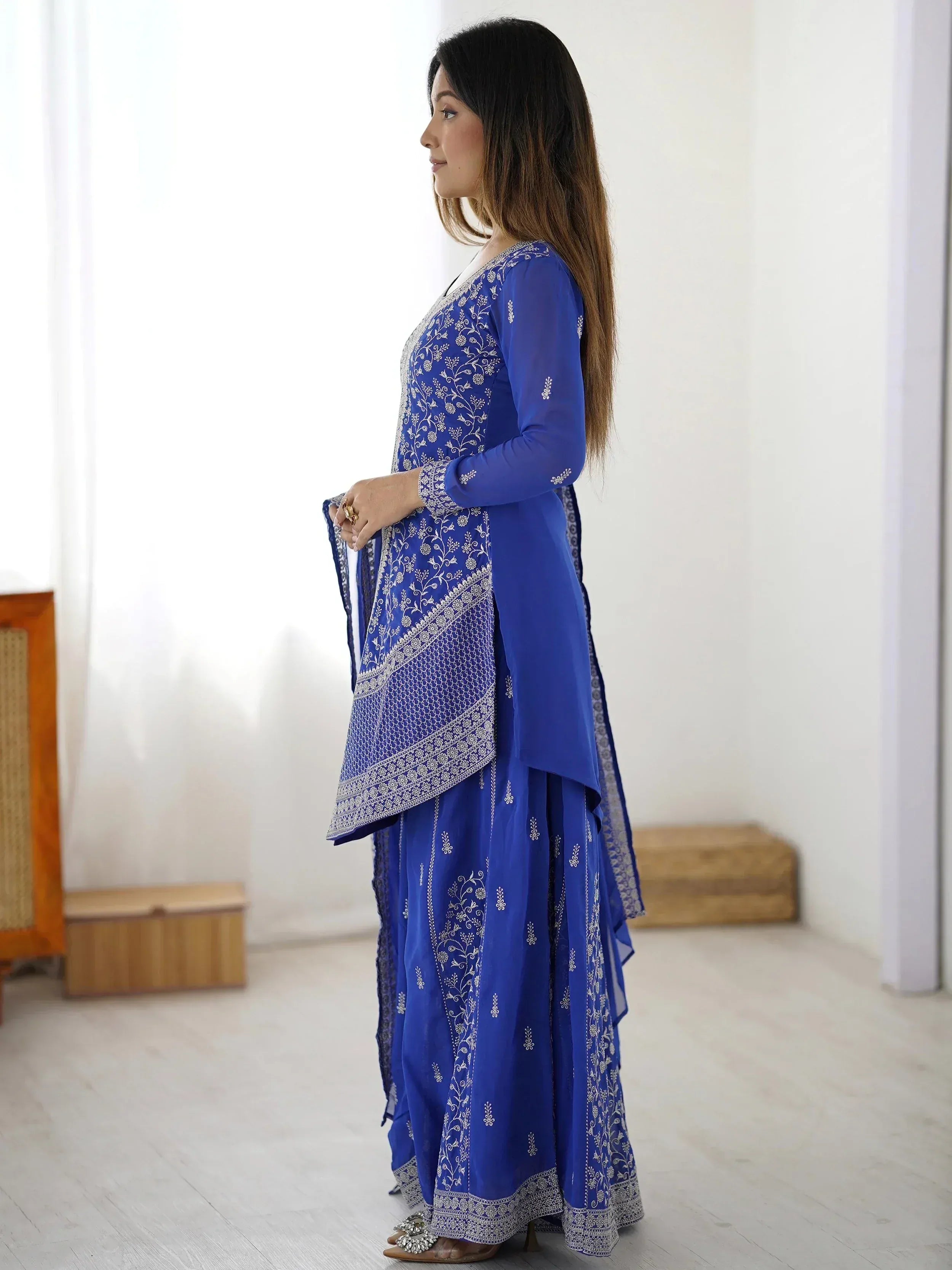 Royal blue embroidered salwar kameez with floral detailing, perfect for Indian ethnic wear occasions.