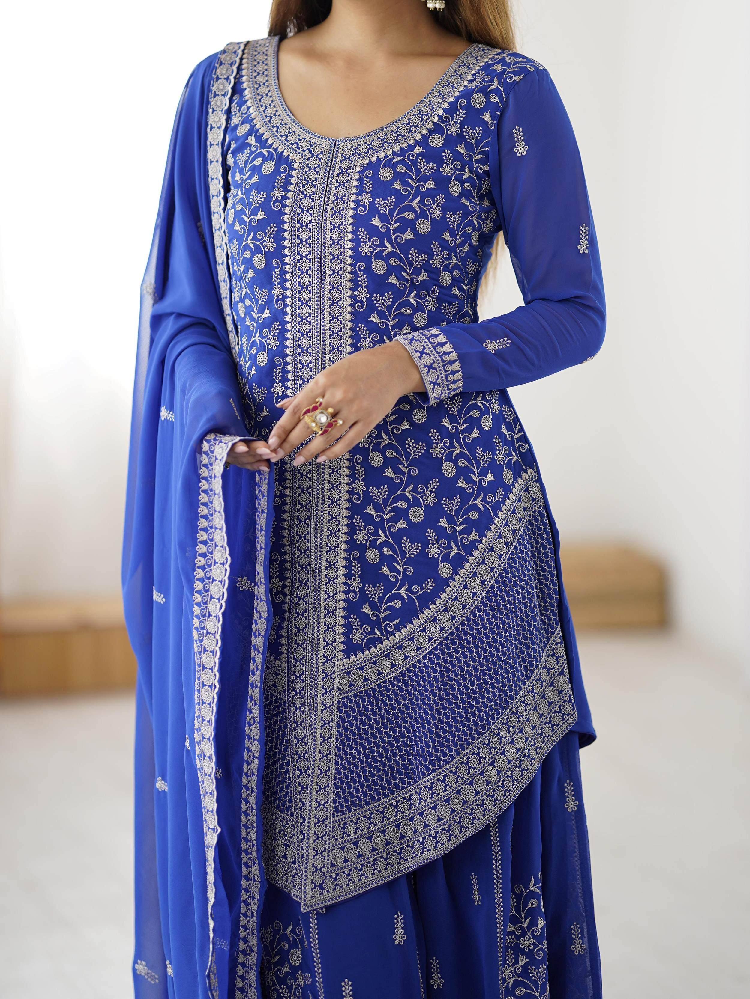 Royal blue embroidered salwar kameez with floral zari work and matching dupatta, perfect for Indian ethnic occasions.