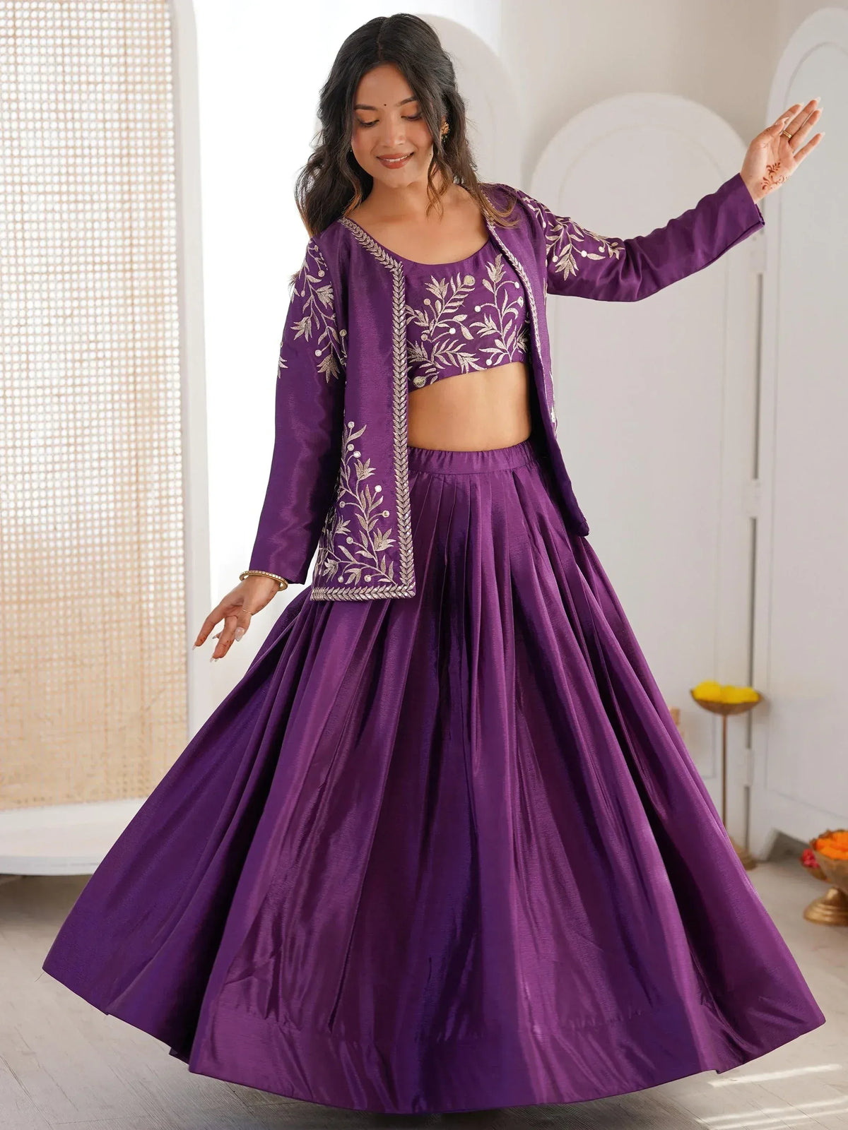 Purple embroidered lehenga choli with floral motifs, perfect for Indian ethnic wear and festive occasions.