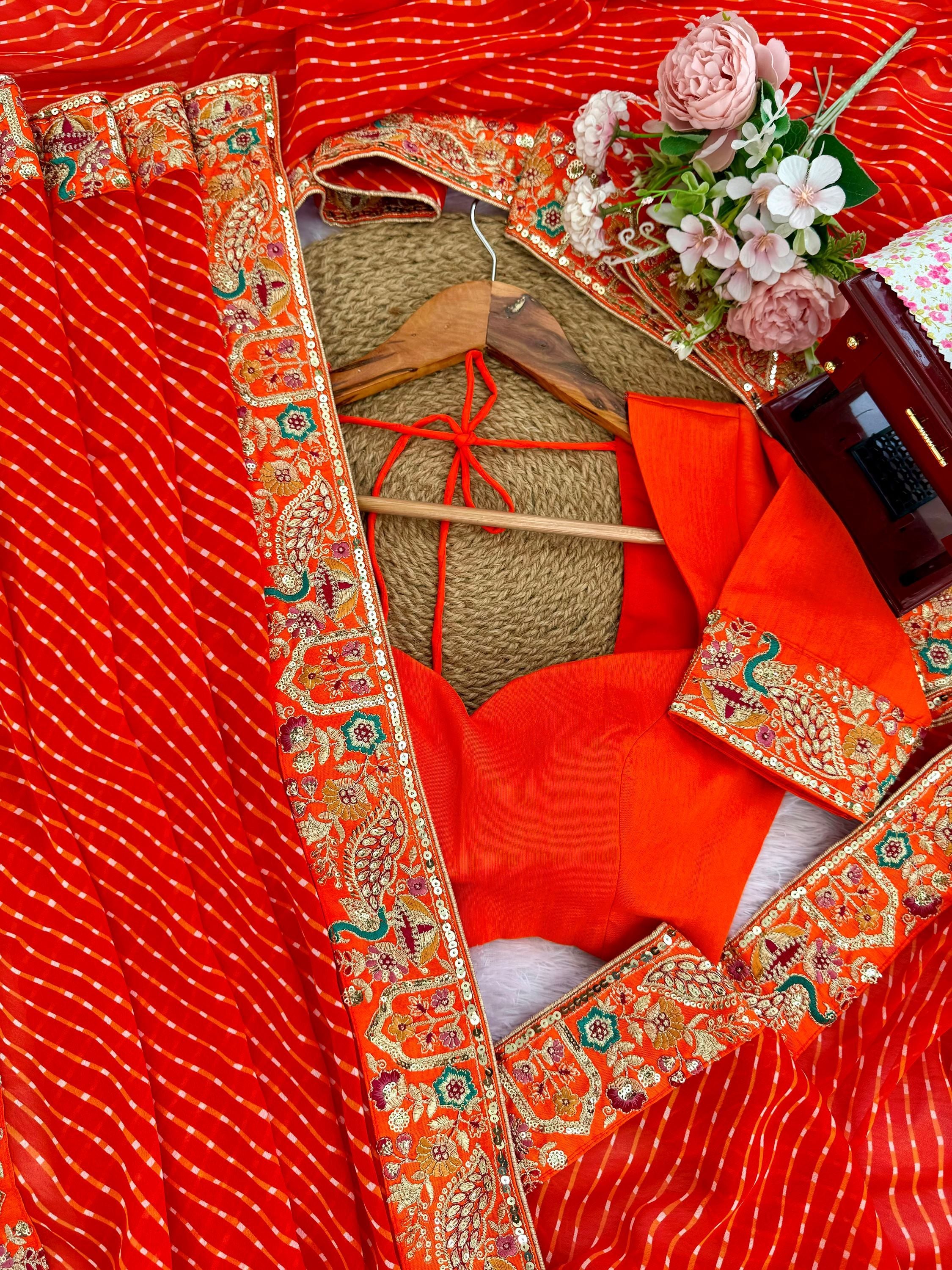 Beautiful Orange Laheriya Printed Georgette Festive Wear Saree With Blouse