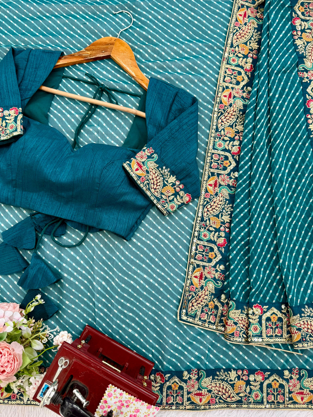 Chic Teal Blue Embroidery Bordered Georgette Event Wear Saree With Blouse