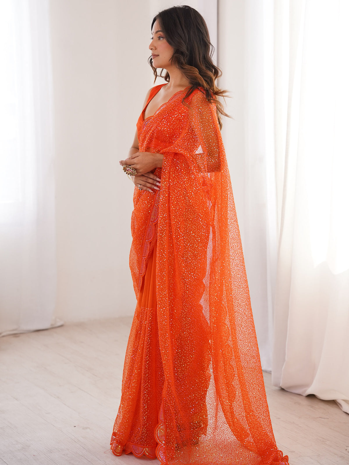 Captivating Orange Sequins Net Traditional Saree With Blouse