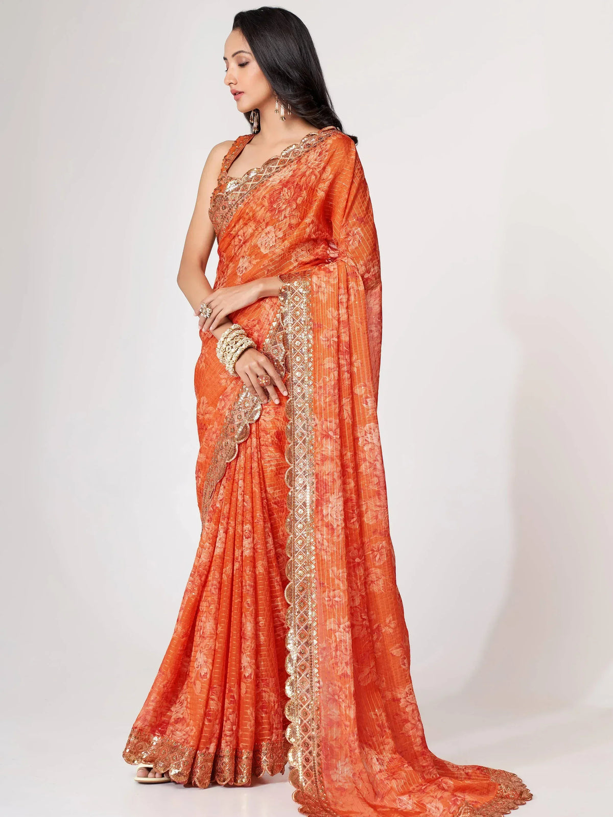 Orange floral saree with gold embroidery, ethnic Indian wear for women