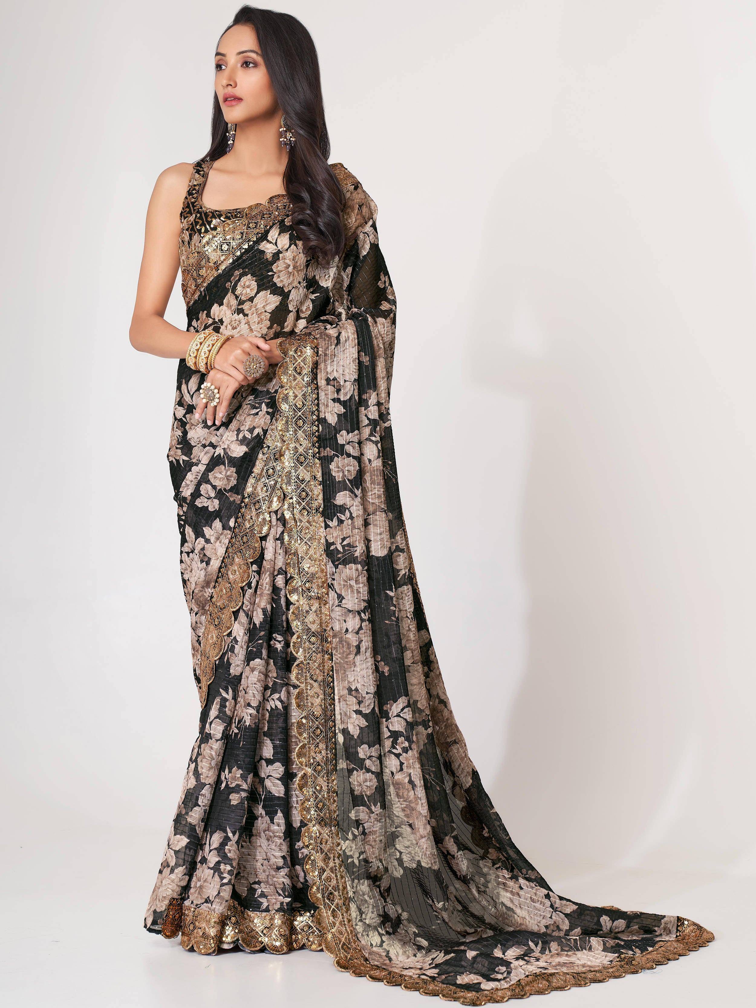 Black and gold floral printed saree with heavy embroidery, perfect for Indian ethnic wear occasions.