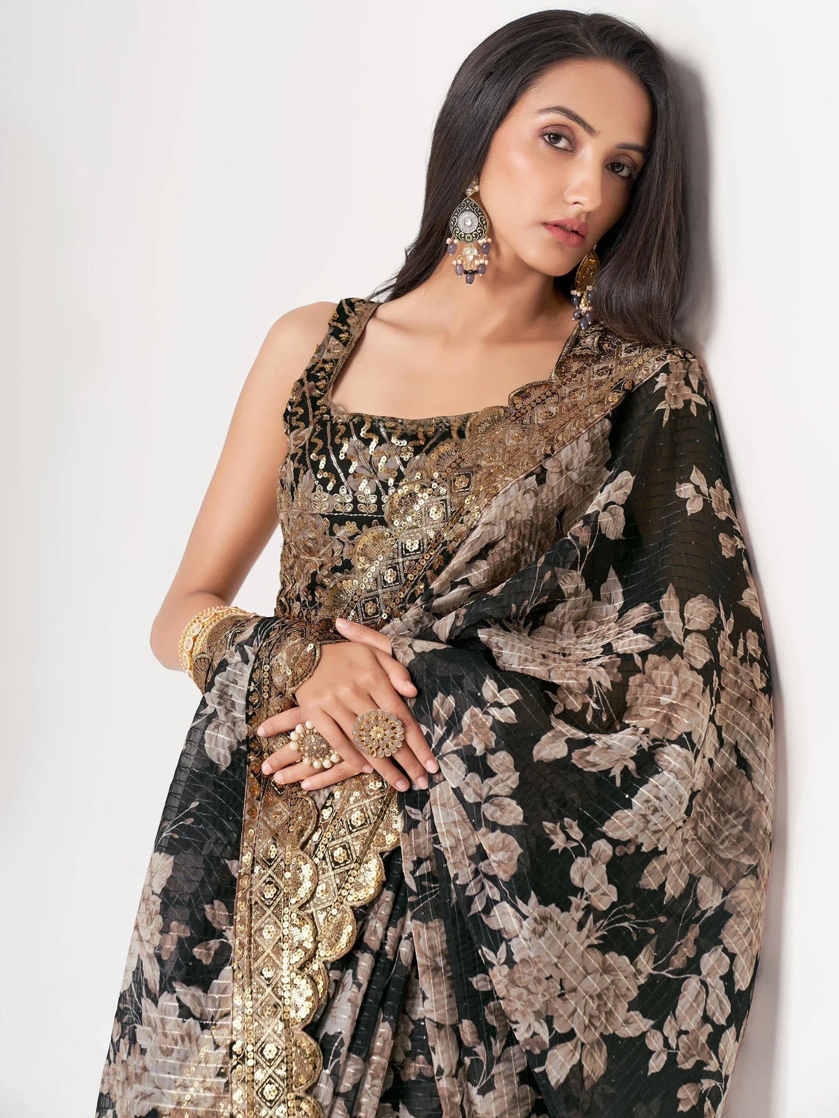 Black and gold embroidered ethnic gown with floral dupatta, perfect for Indian occasions