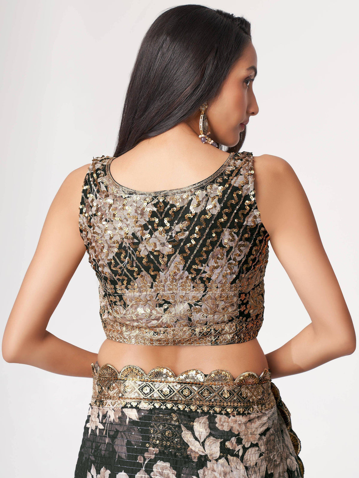 Black and gold sequin lehenga choli with floral embroidery, back view