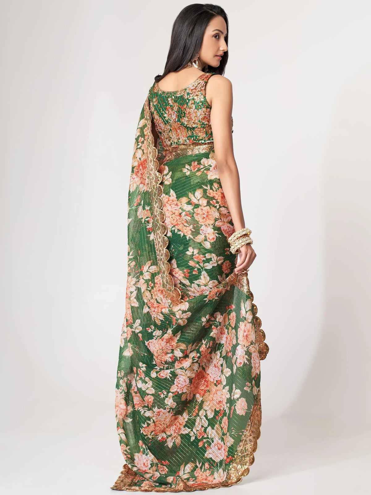 Green floral saree with gold embroidery, perfect for Indian ethnic wear occasions