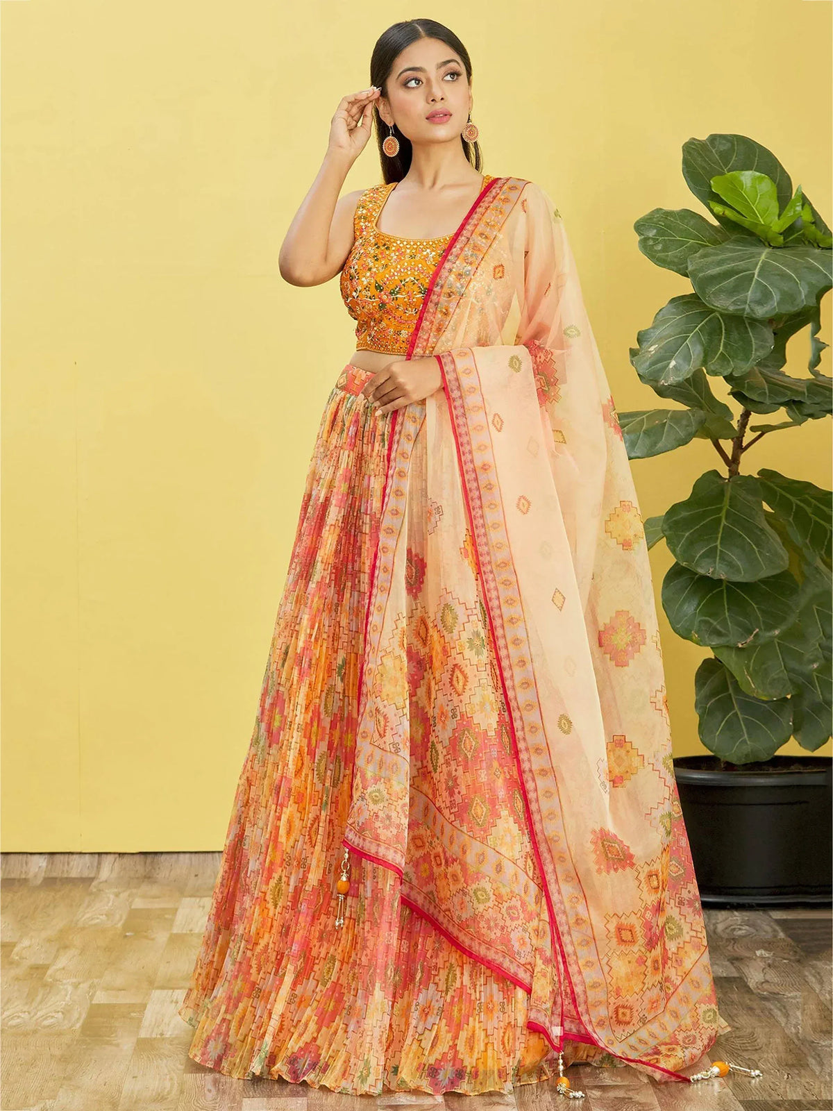 Orange and pink printed lehenga choli with embroidered blouse and dupatta