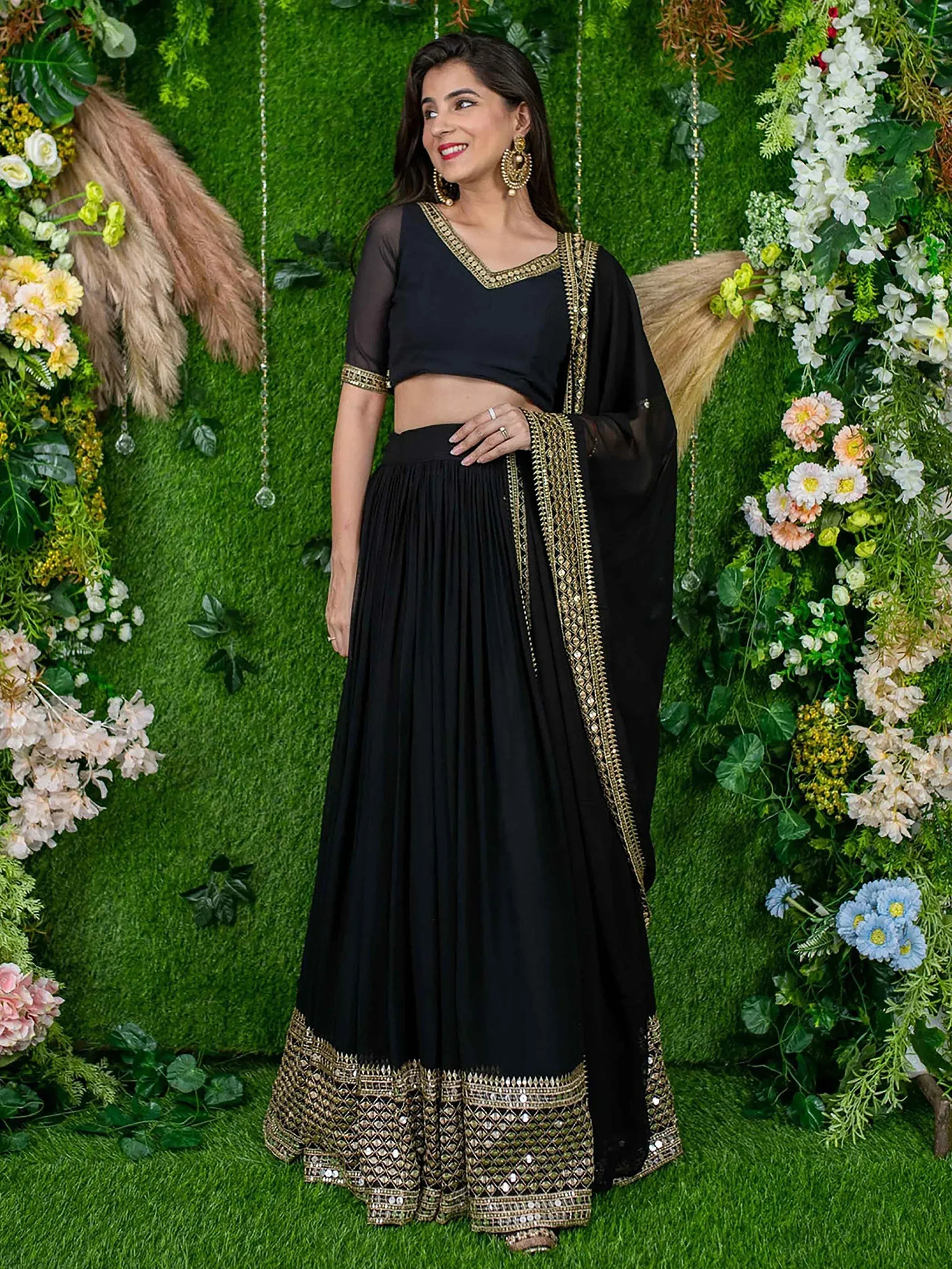 Black lehenga choli with gold embroidery, perfect for Indian ethnic wear and festive occasions.