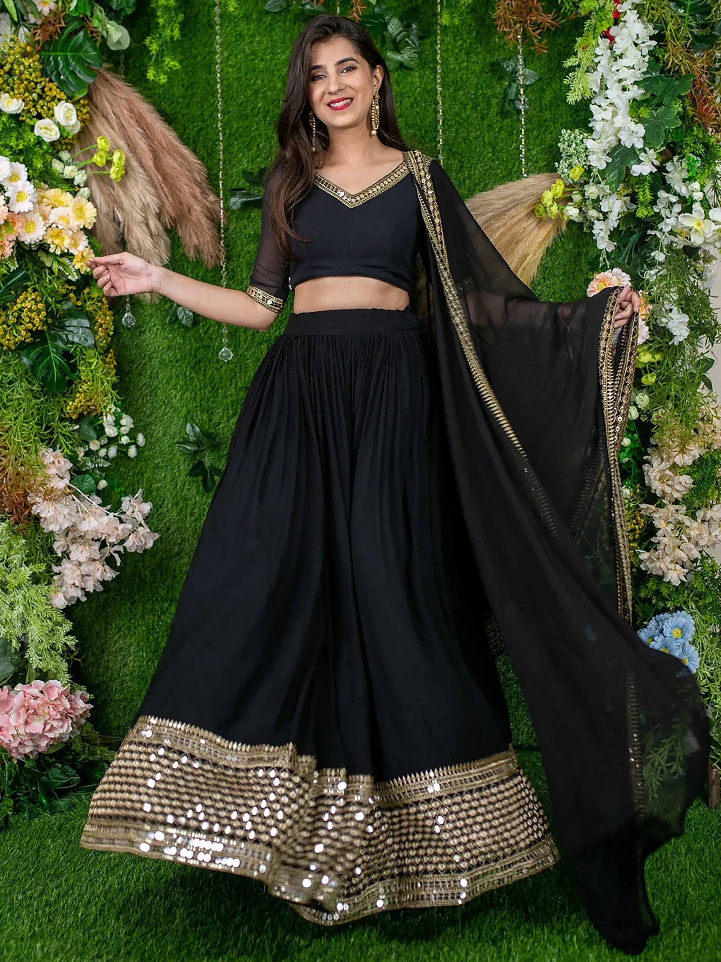 Black lehenga choli with gold mirror work and sheer dupatta, perfect for Indian ethnic occasions