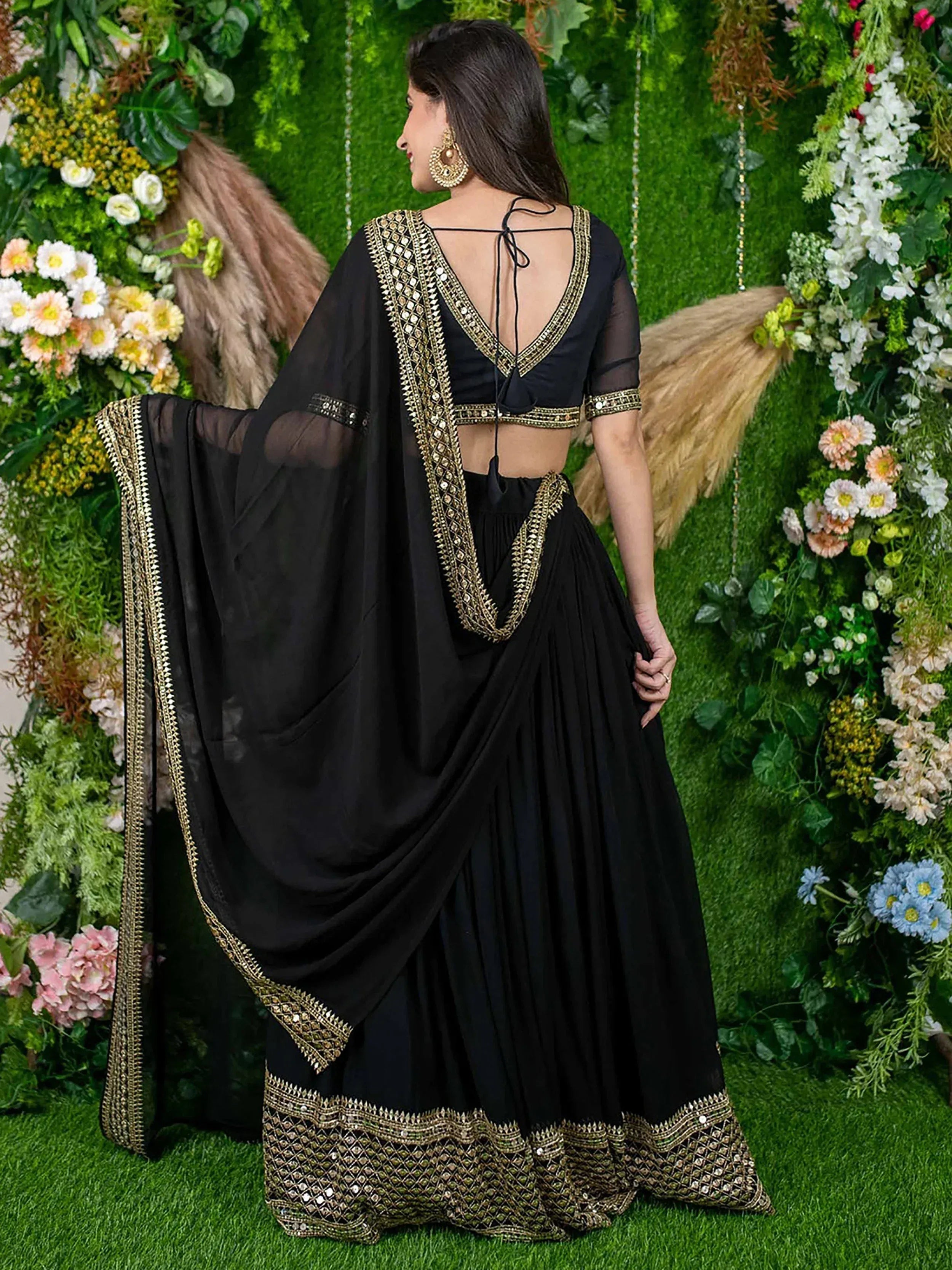 Black designer lehenga choli with gold mirror work, perfect for Indian ethnic wear events