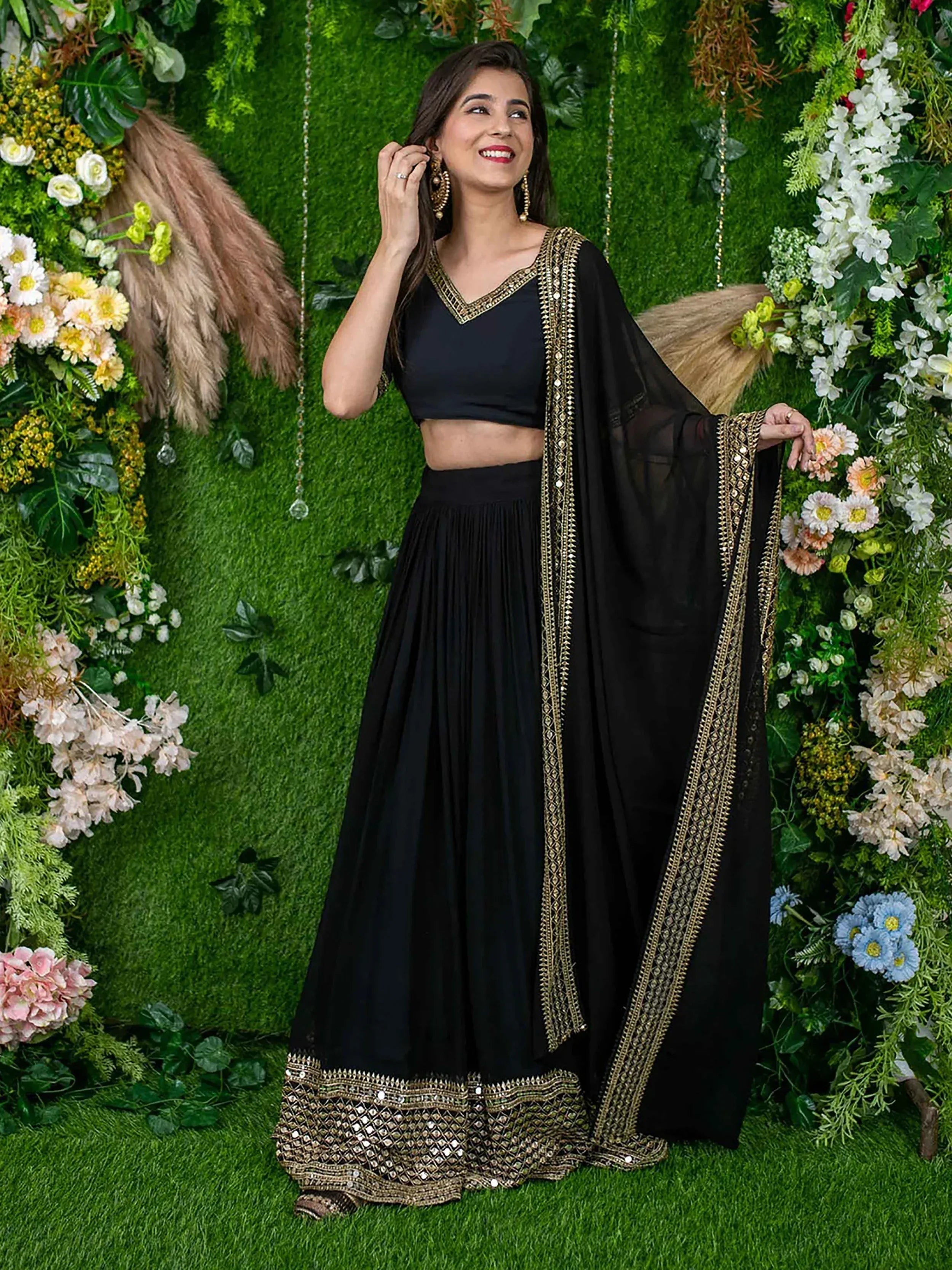 Black ethnic lehenga choli with gold embroidery, perfect for Indian weddings and parties