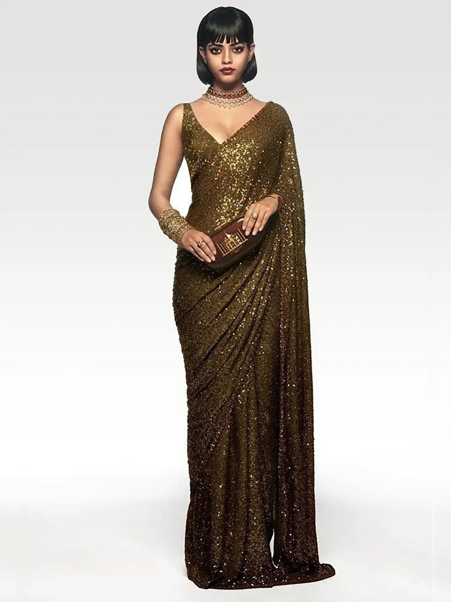 Elegant gold sequin saree with V-neck blouse, perfect for Indian ethnic wear events and parties.