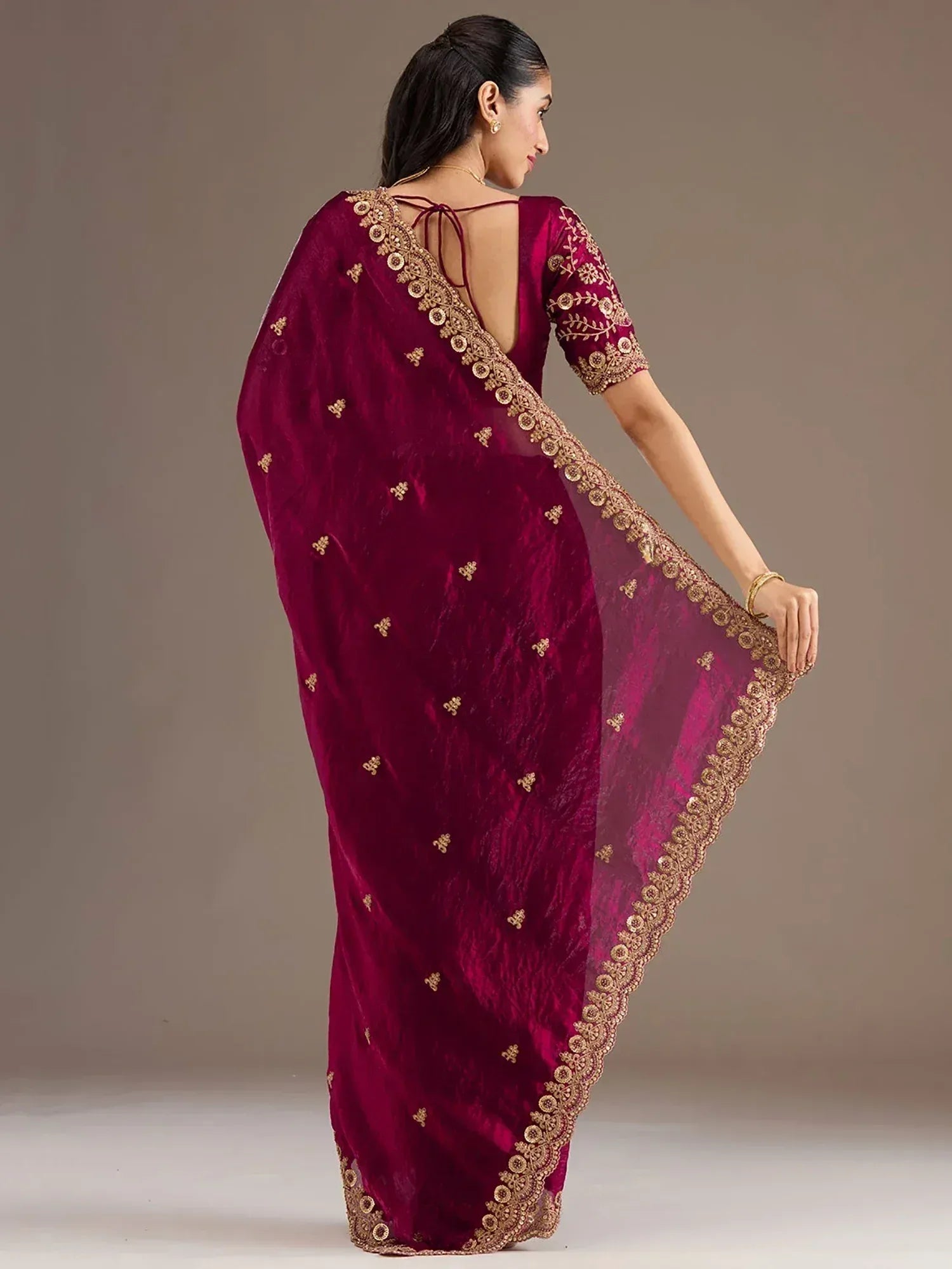 Maroon velvet saree with gold embroidery, back view, ethnic Indian wear