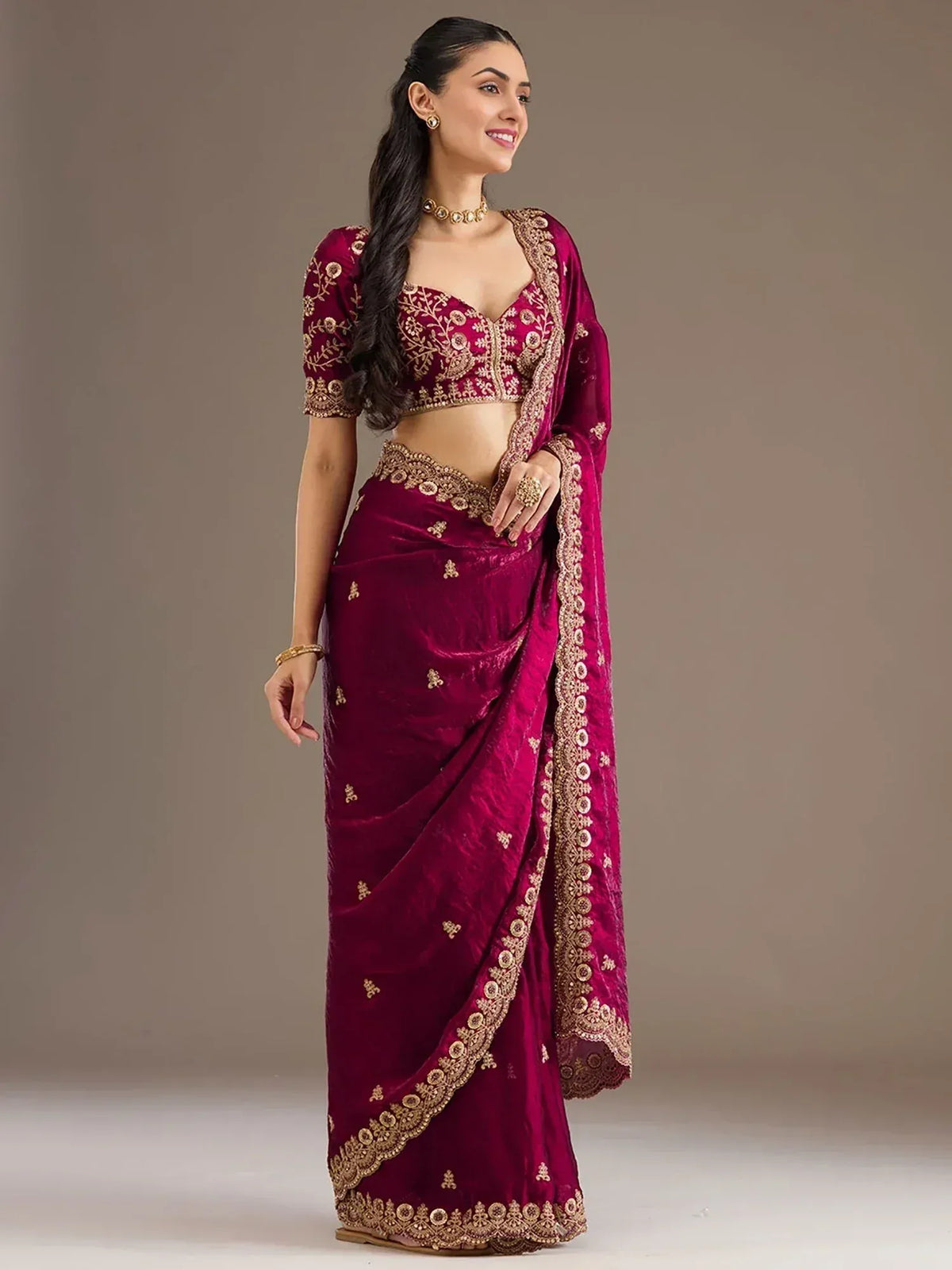 Burgundy velvet saree with gold embroidery, perfect for Indian ethnic wear and festive occasions.