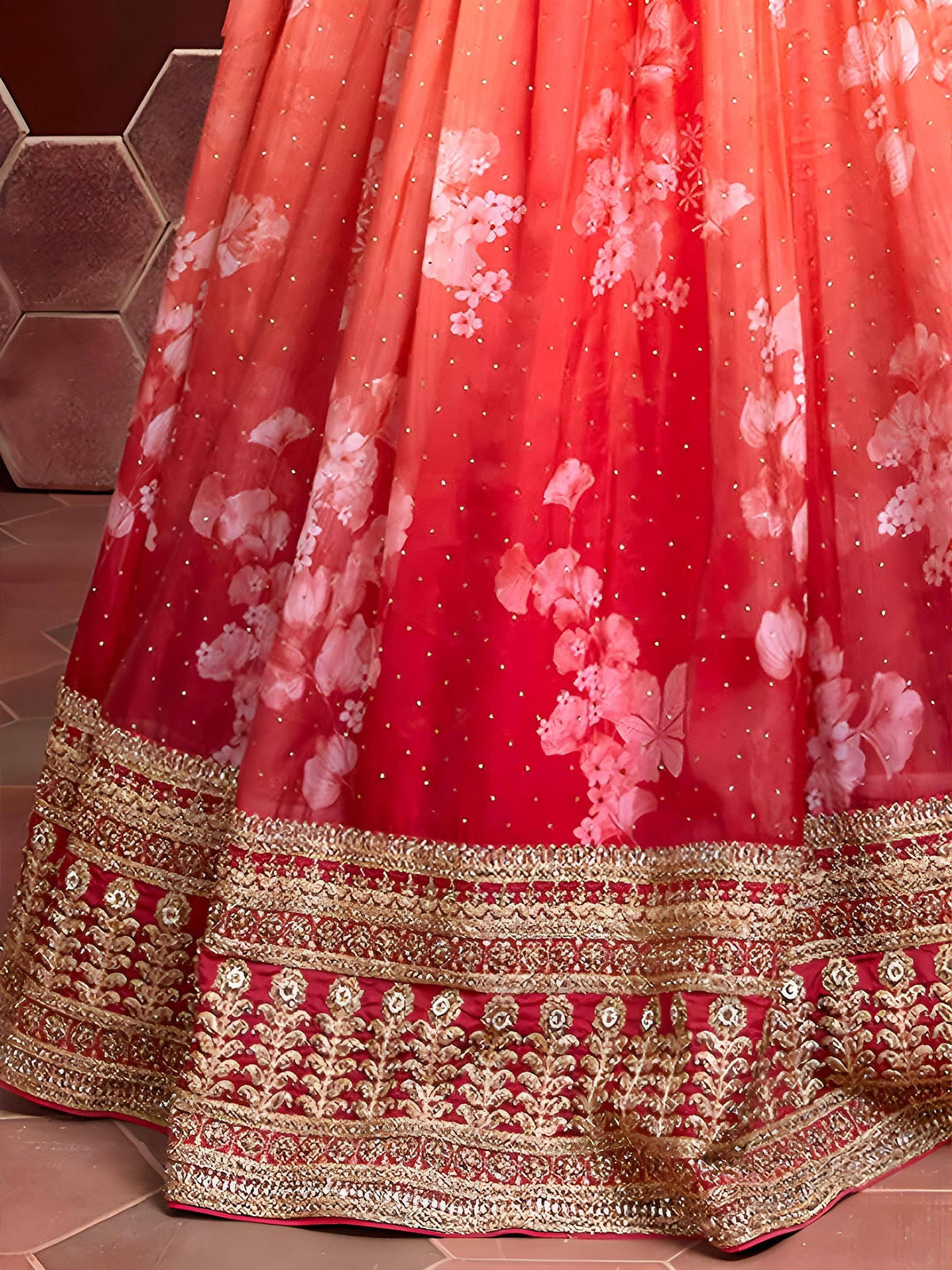 Red floral lehenga with gold embroidery and sheer overlay, perfect for Indian weddings and ethnic events