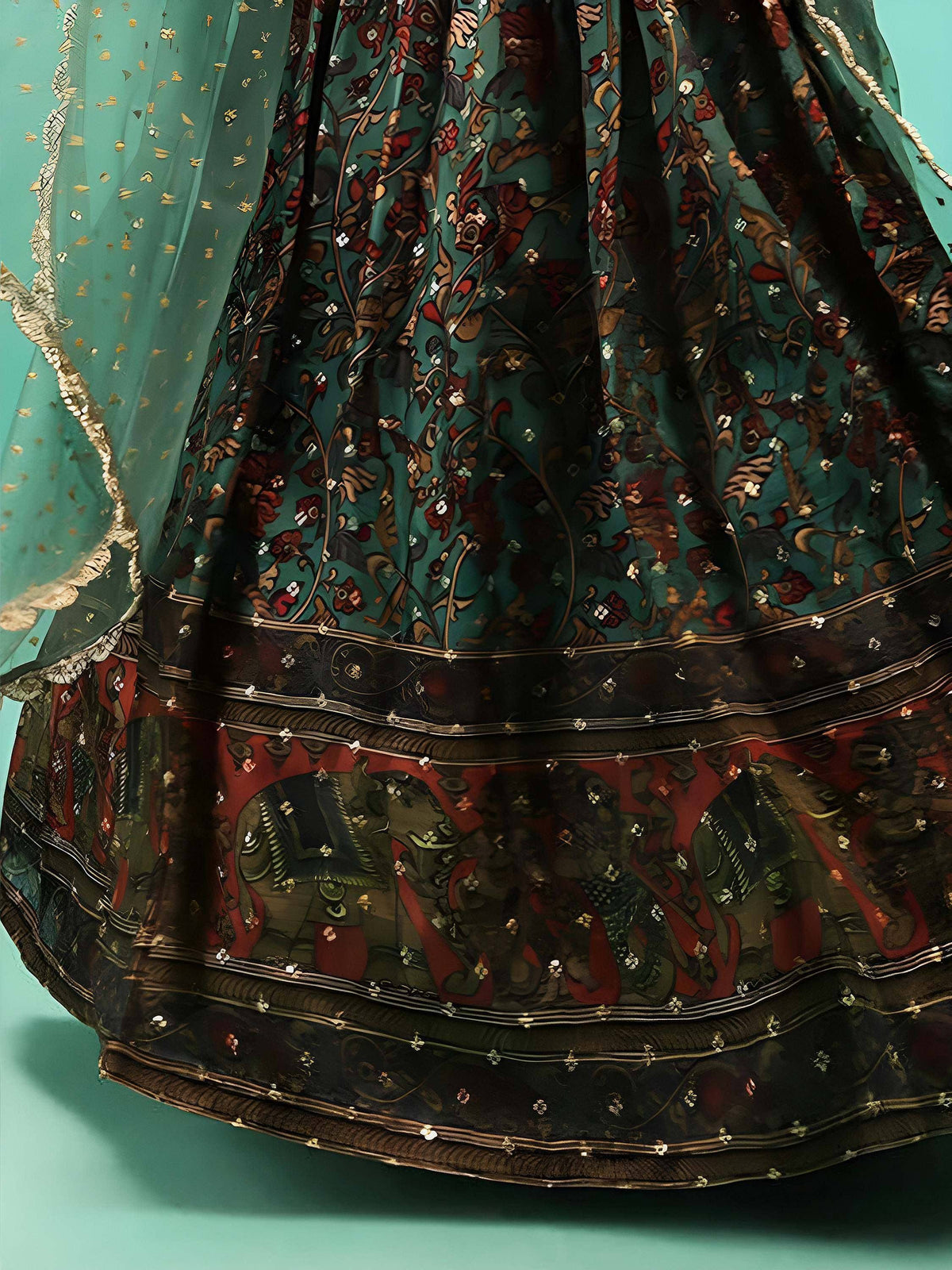 Teal floral embroidered lehenga with elephant motifs and gold detailing, perfect for ethnic wear.